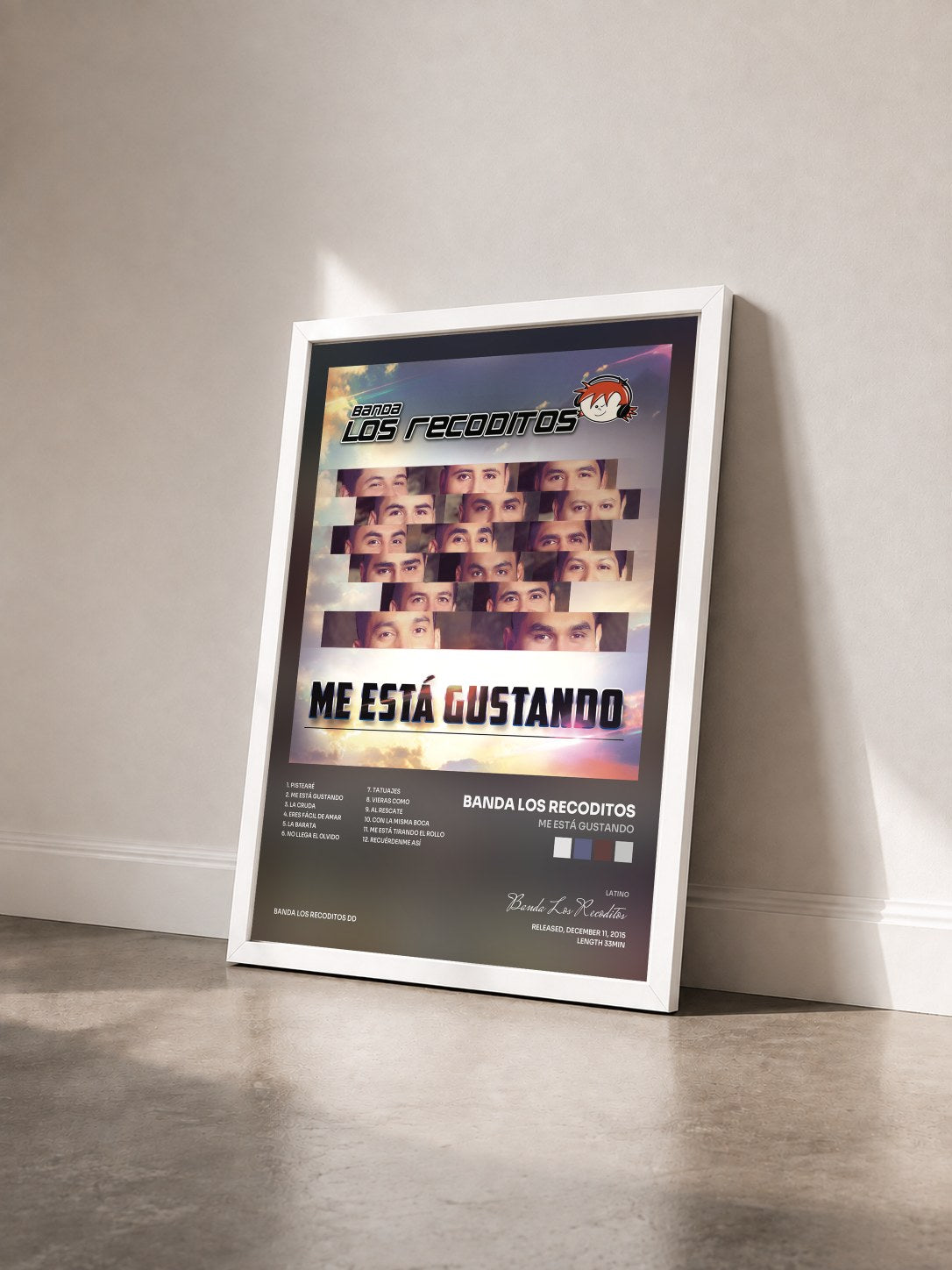 #blanc Tableau de l'album Me Está Gustando de Banda Los Recoditos vu de trois quarts, cadre blanc