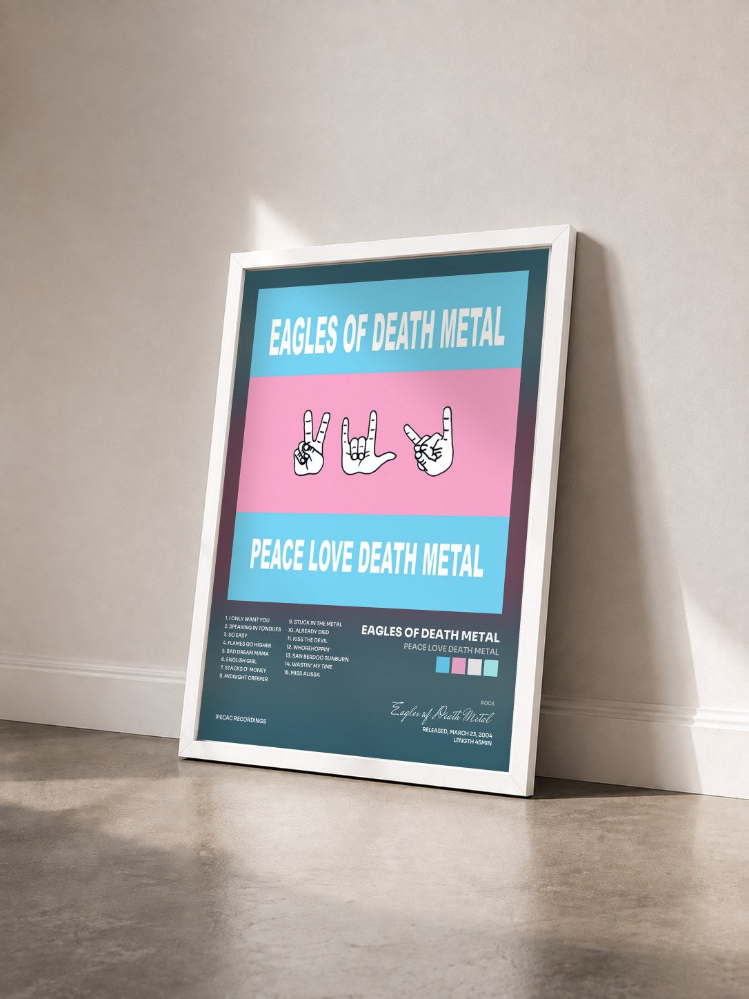 #blanc Tableau de l'album Peace Love Death Metal de Eagles of Death Metal vu de trois quarts, cadre blanc