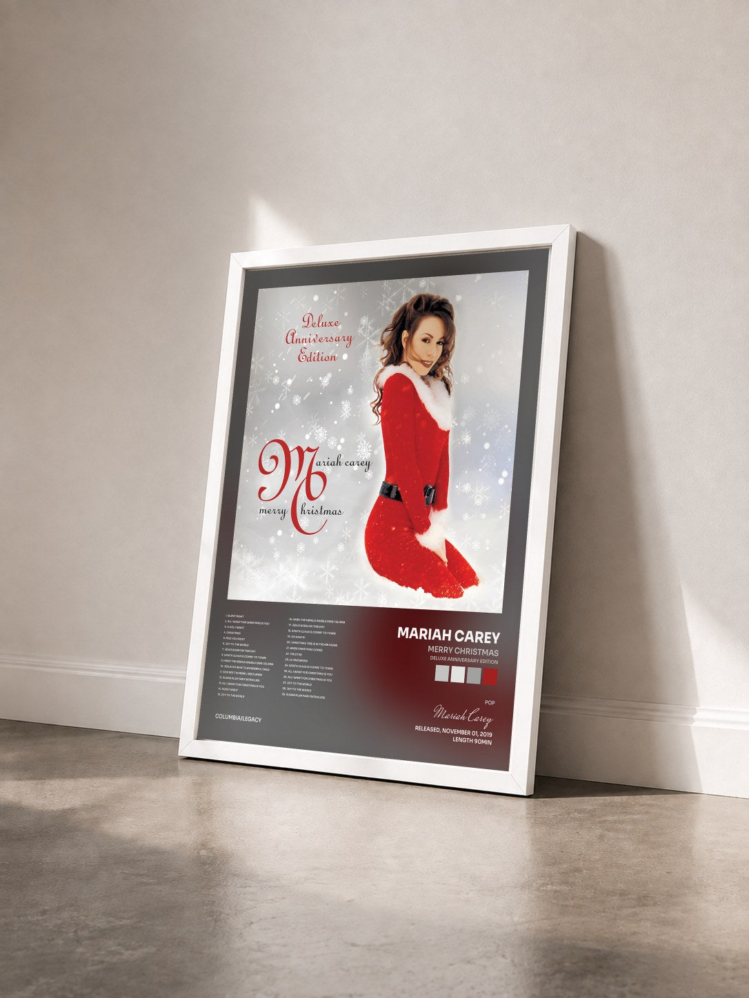 #blanc Tableau de l'album Merry Christmas (Deluxe Anniversary Edition) de Mariah Carey vu de trois quarts, cadre blanc