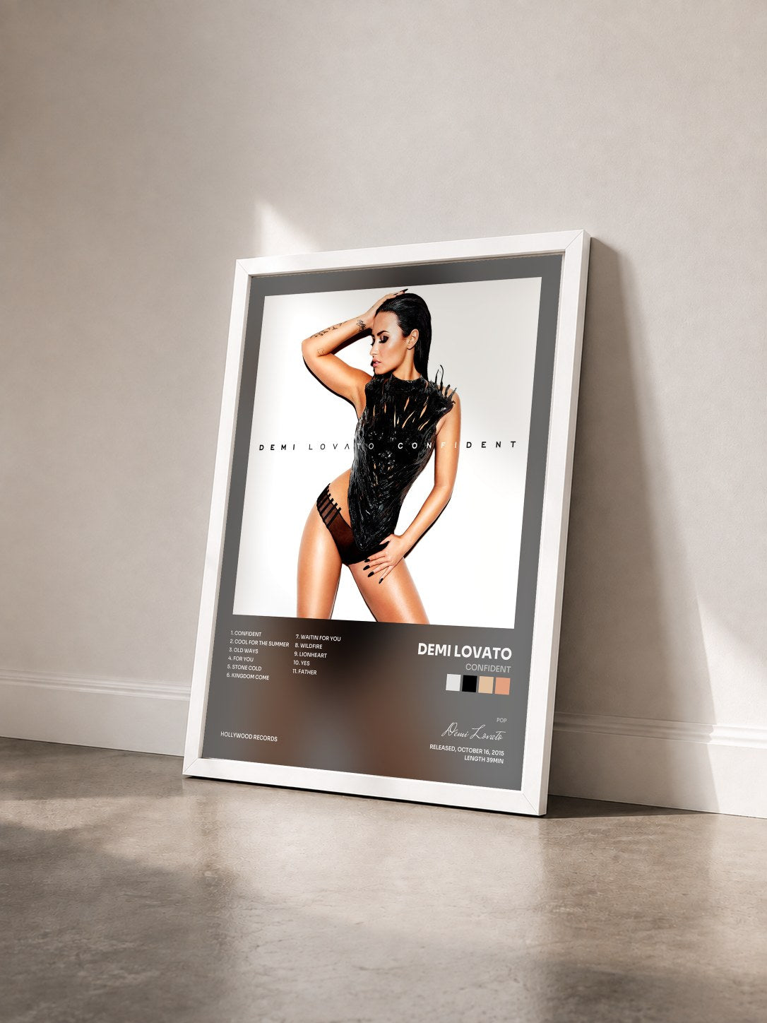#blanc Tableau de l'album Confident de Demi Lovato vu de trois quarts, cadre blanc