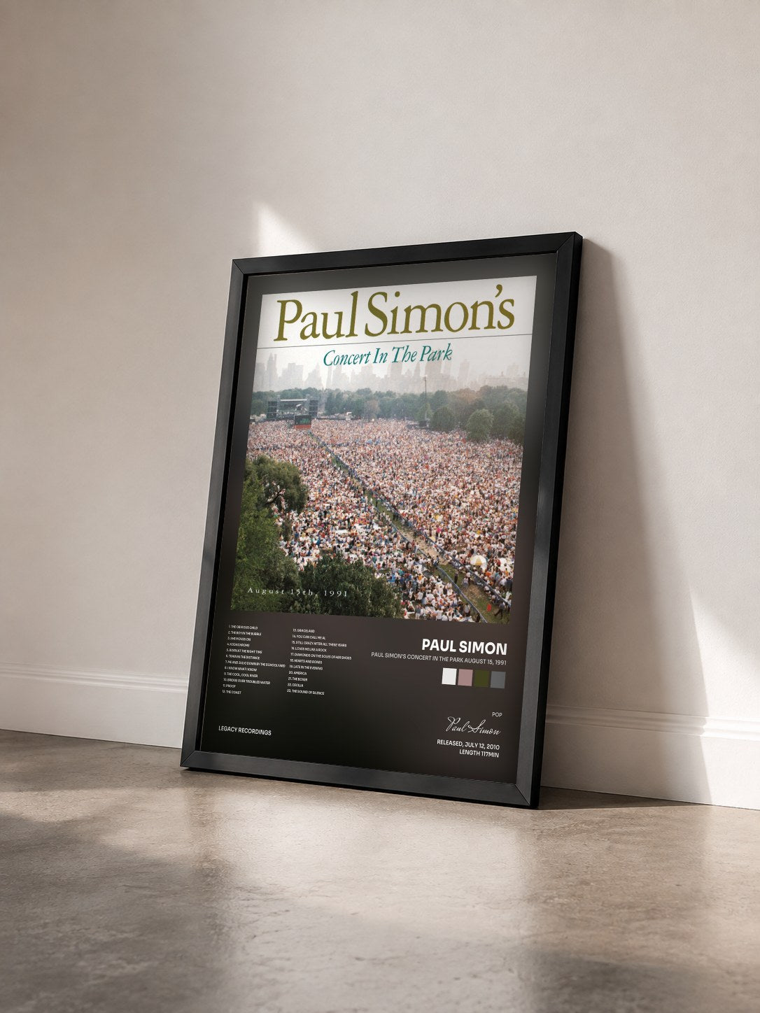 #noir Tableau de l'album Paul Simon's Concert In The Park August 15, 1991 de Paul Simon vu de trois quarts, cadre noir