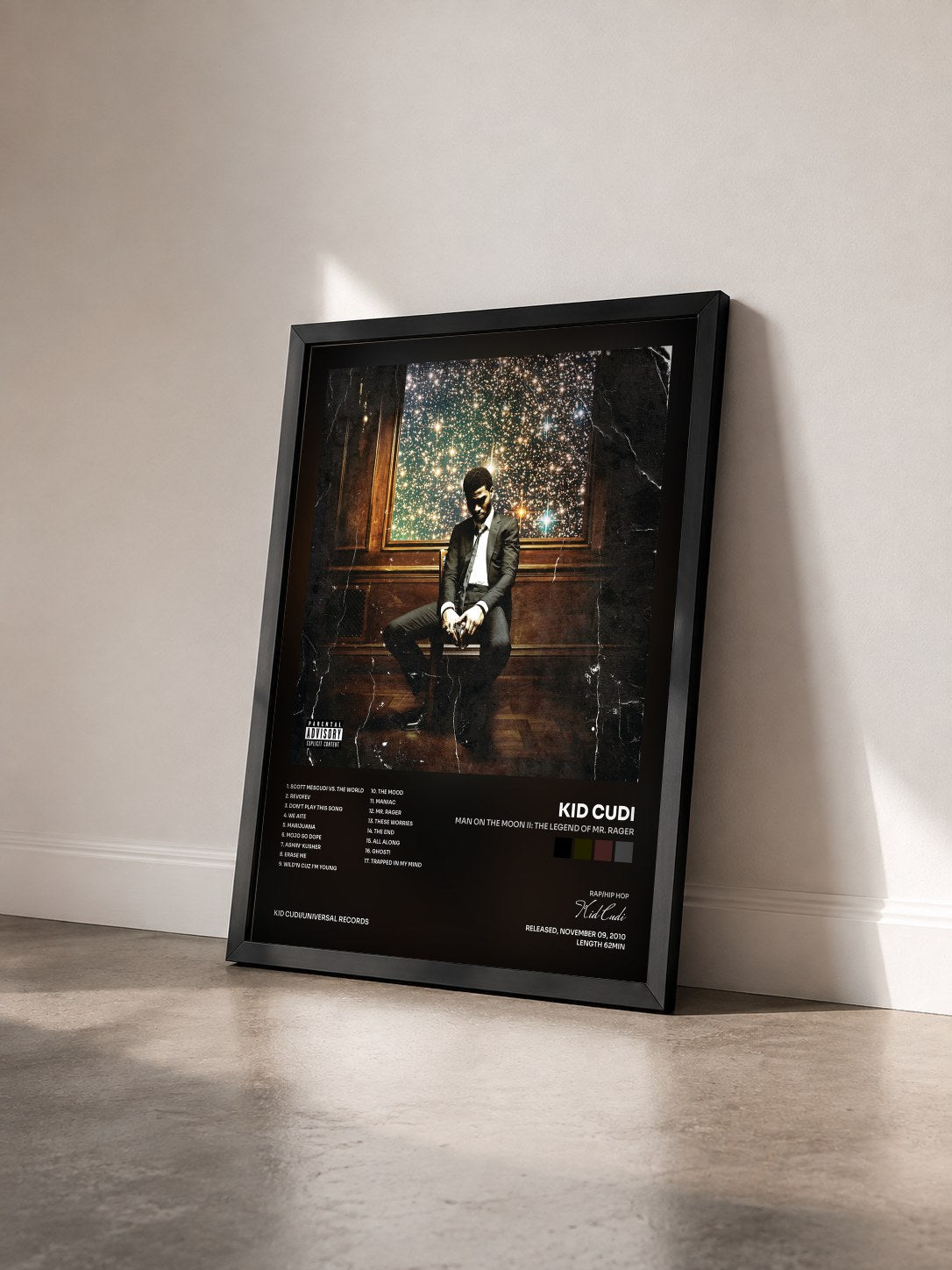 #noir Tableau de l'album Man On The Moon II: The Legend Of Mr. Rager de Kid Cudi vu de trois quarts, cadre noir