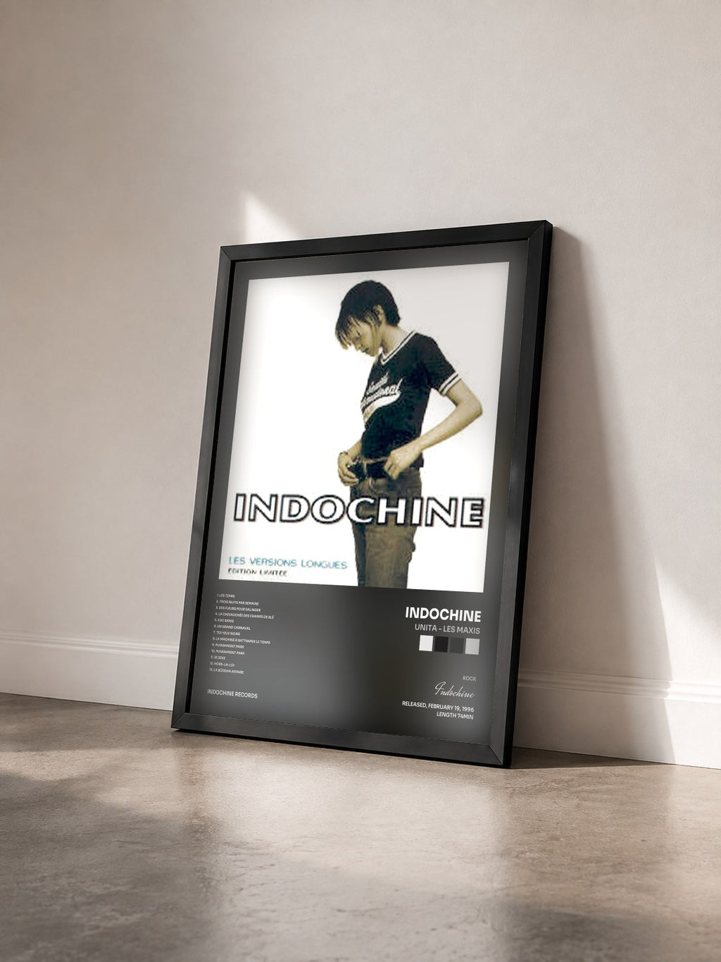 #noir Unita - Les Maxis by Indochine as a framed art print seen at an angle, black frame