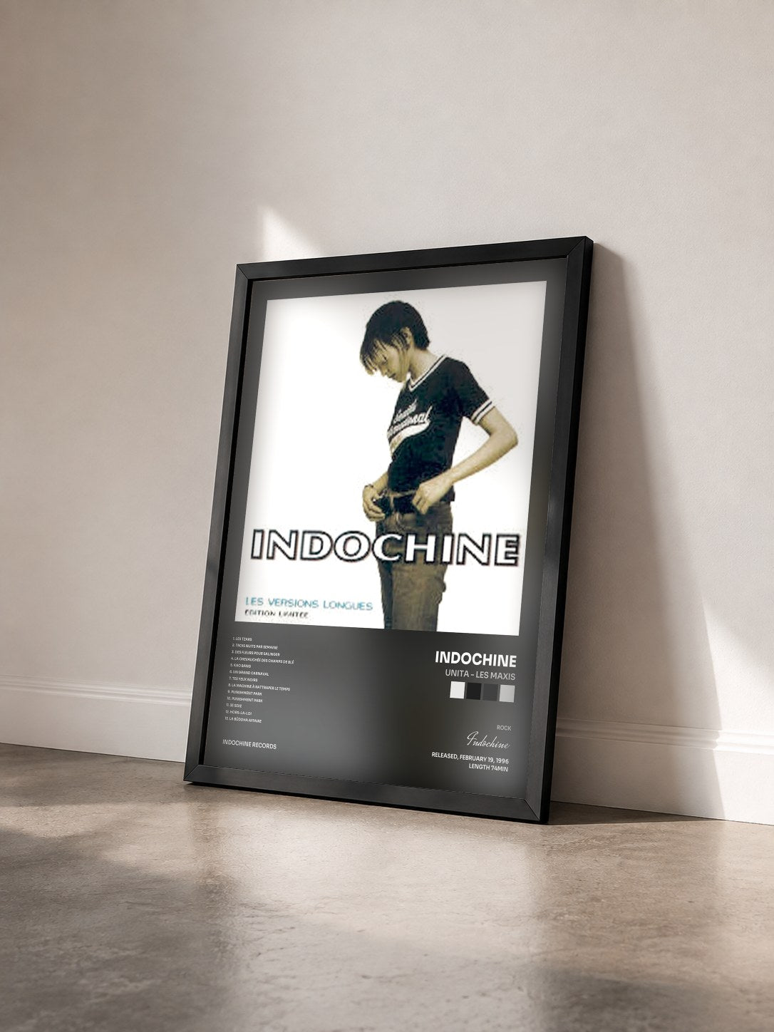 #noir Unita - Les Maxis by Indochine as a framed art print seen at an angle, black frame