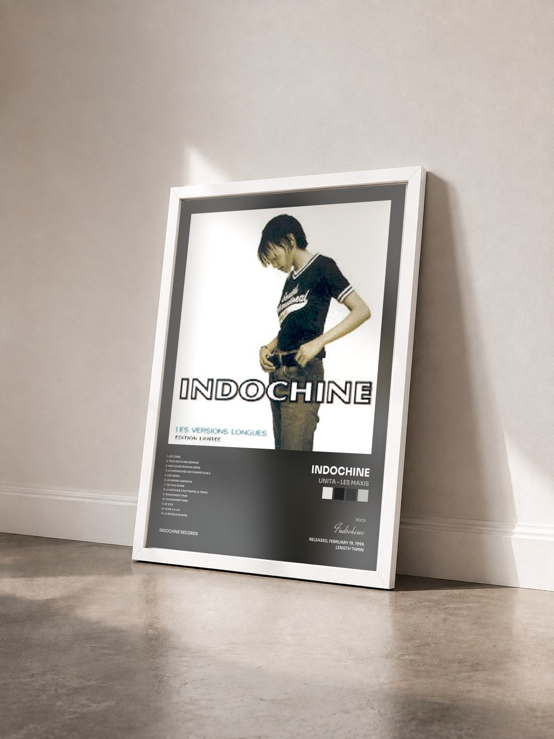 #blanc Unita - Les Maxis by Indochine as a framed art print seen at an angle, white frame