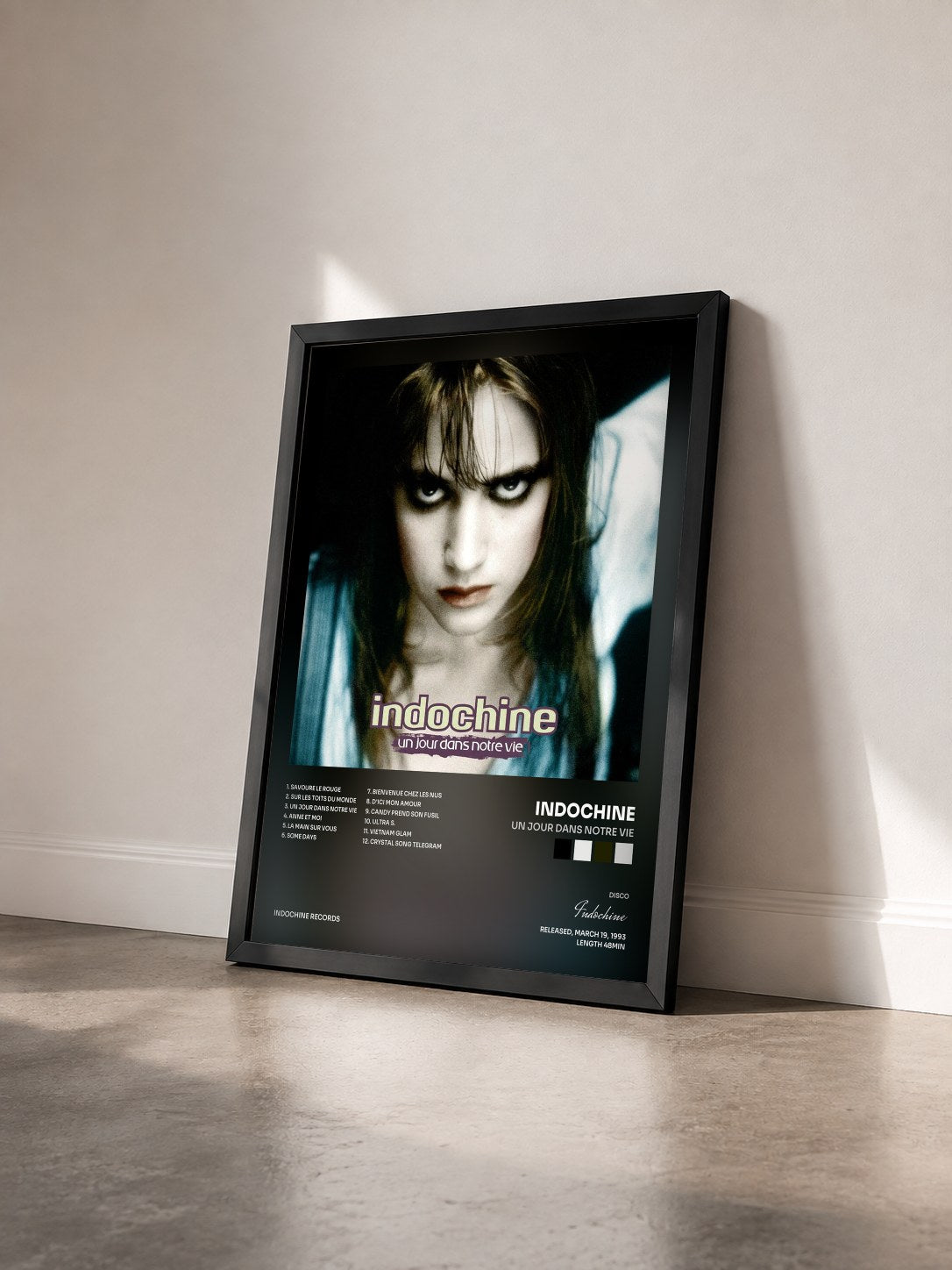 #noir Un jour dans notre vie by Indochine as a framed art print seen at an angle, black frame