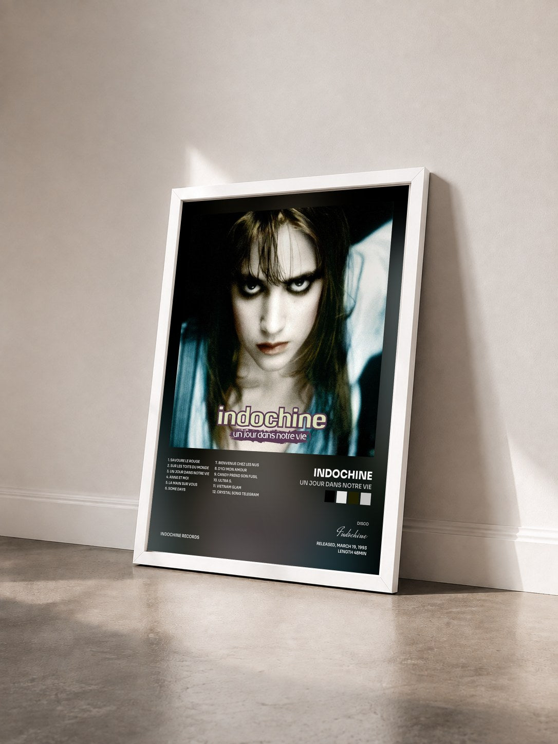 #blanc Un jour dans notre vie by Indochine as a framed art print seen at an angle, white frame
