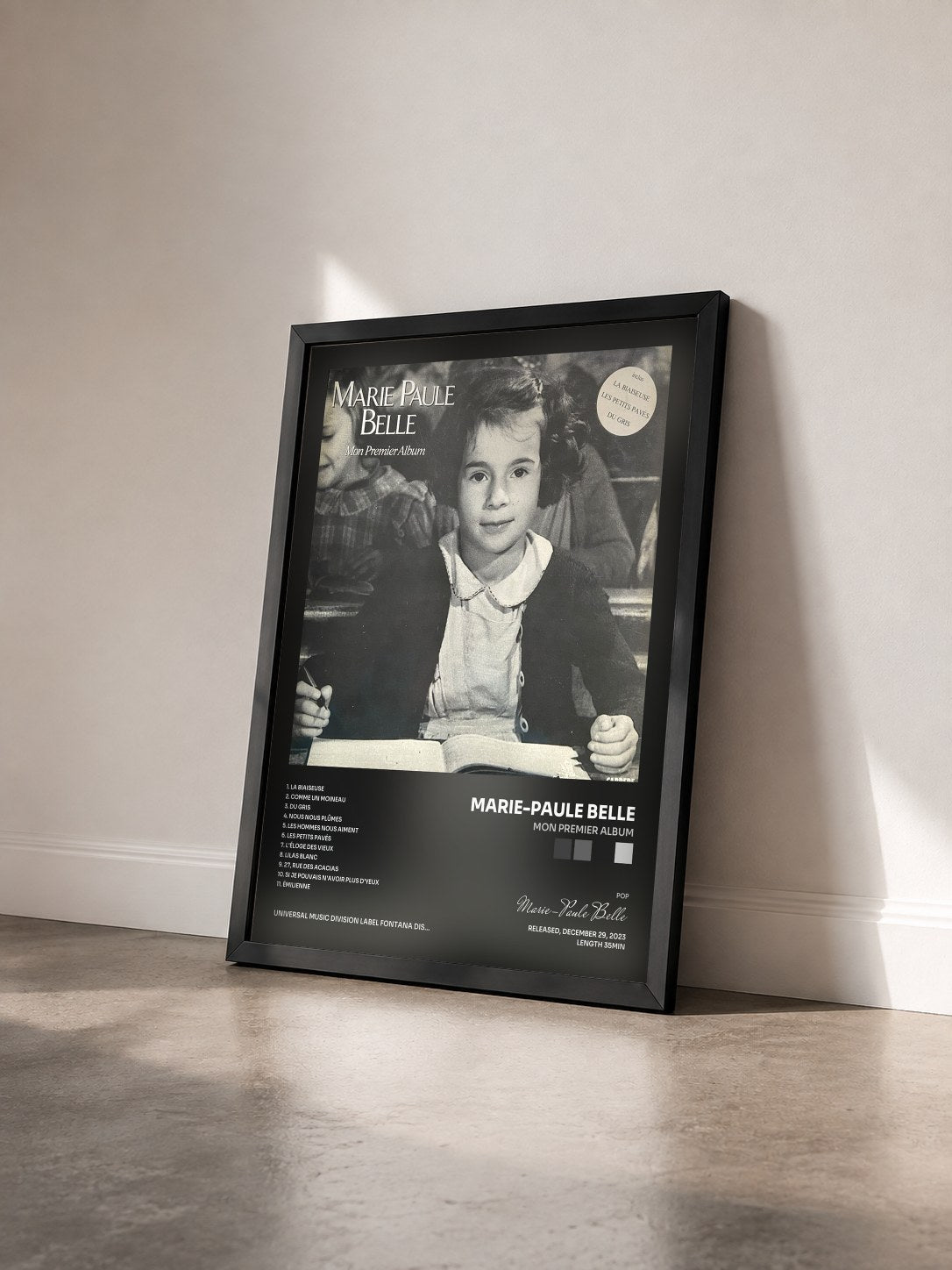 #noir Mon premier album by Marie-Paule Belle as a framed art print seen at an angle, black frame