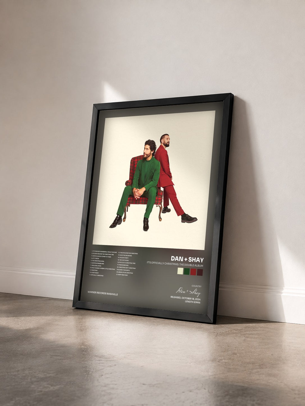 #noir Tableau de l'album It's Officially Christmas: The Double Album de Dan + Shay vu de trois quarts, cadre noir