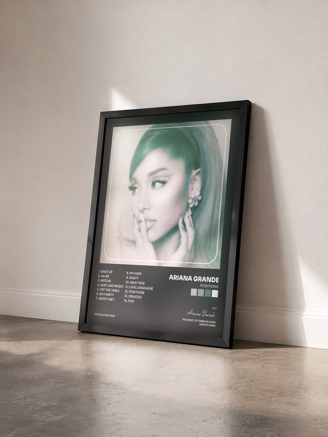 #noir Positions by Ariana Grande as a framed art print seen at an angle, black frame