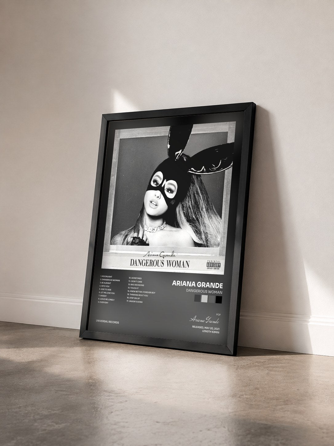#noir Dangerous Woman by Ariana Grande as a framed art print seen at an angle, black frame