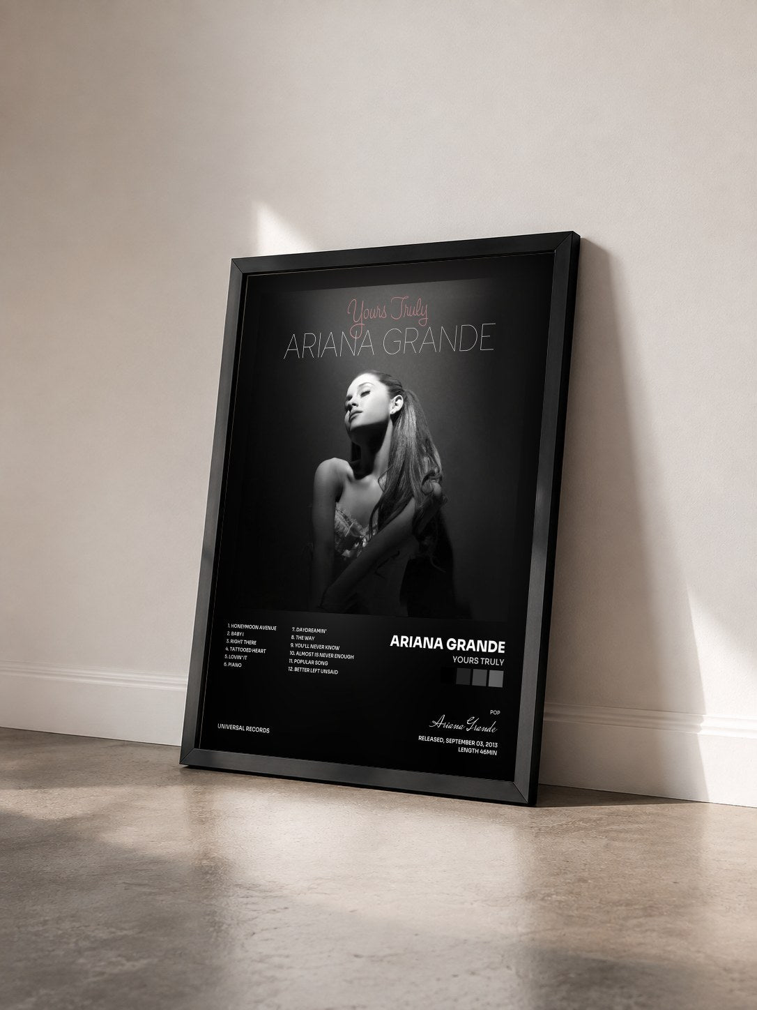 #noir Yours Truly by Ariana Grande as a framed art print seen at an angle, black frame