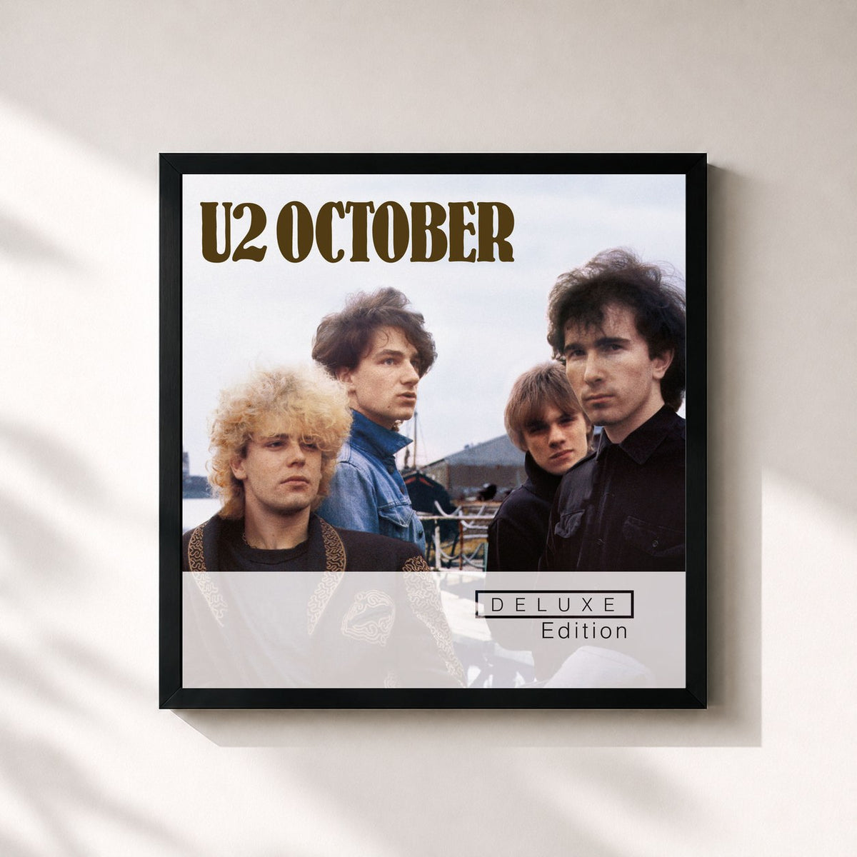 #noir October (Deluxe Edition Remastered) by U2 as a square framed art print, black 32x32 cm frame