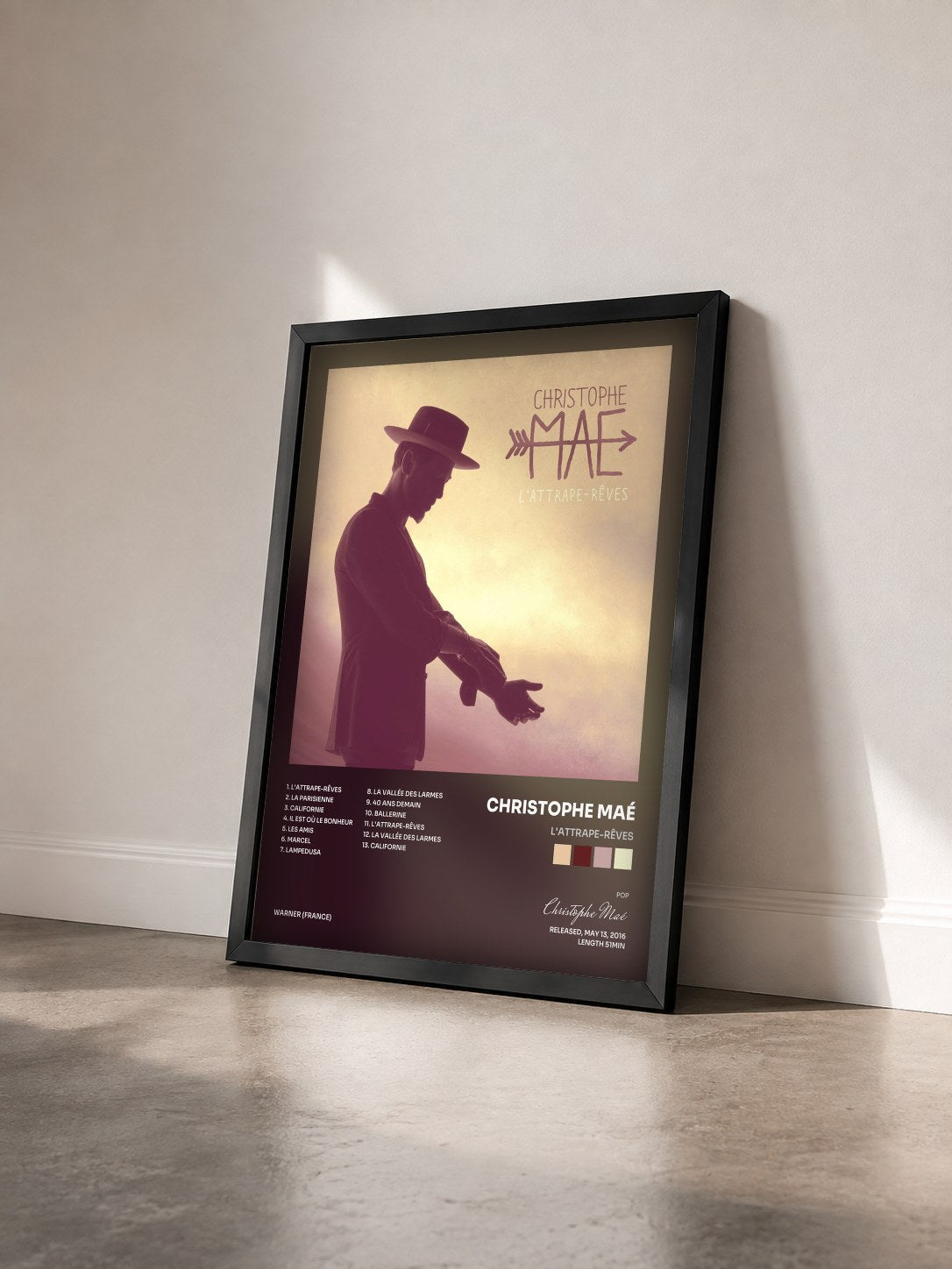 #noir Tableau de l'album L'attrape-rêves de Christophe Maé vu de trois quarts, cadre noir