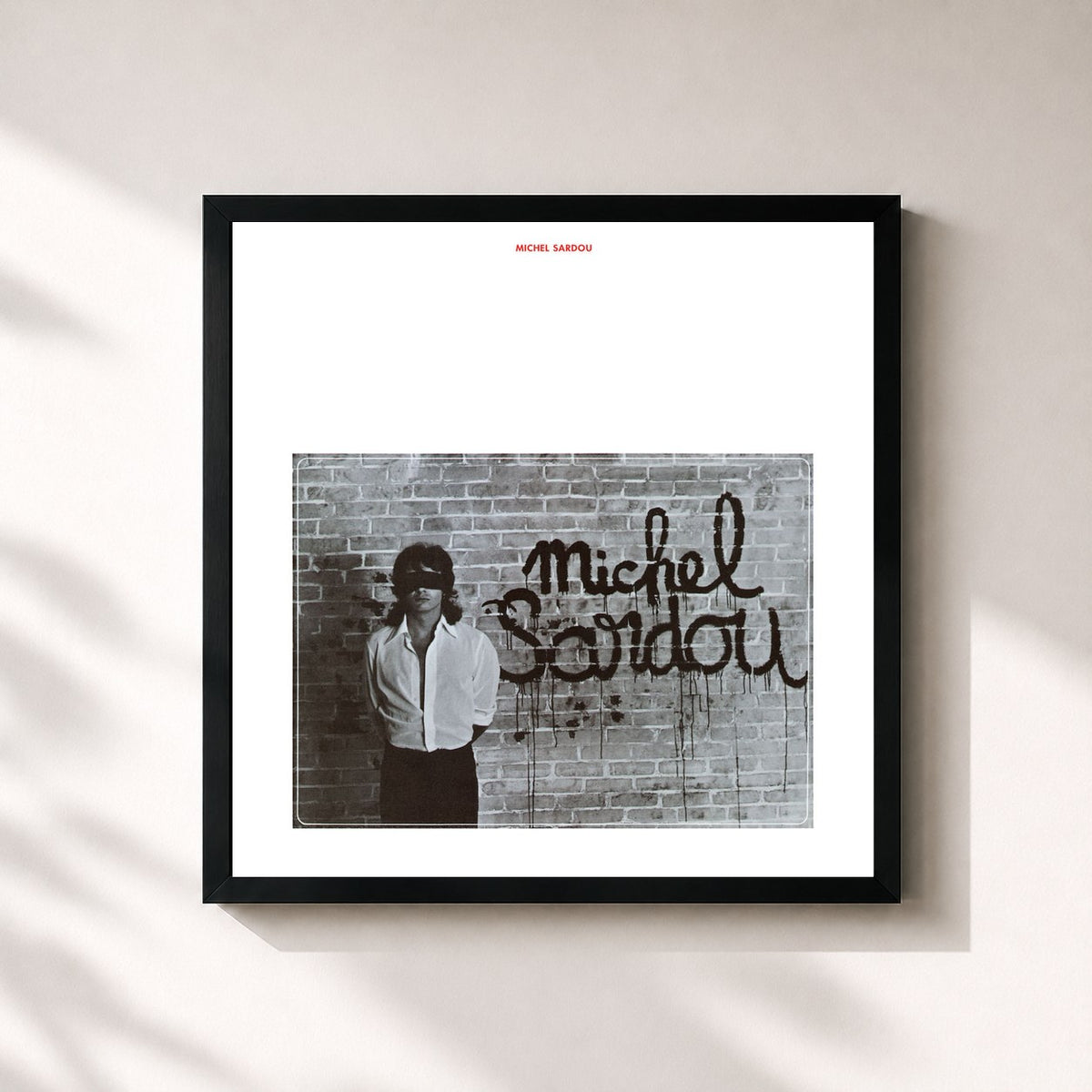 #noir Danton de Michel Sardou en lámina cuadrada enmarcada, marco negro de 32x32 cm