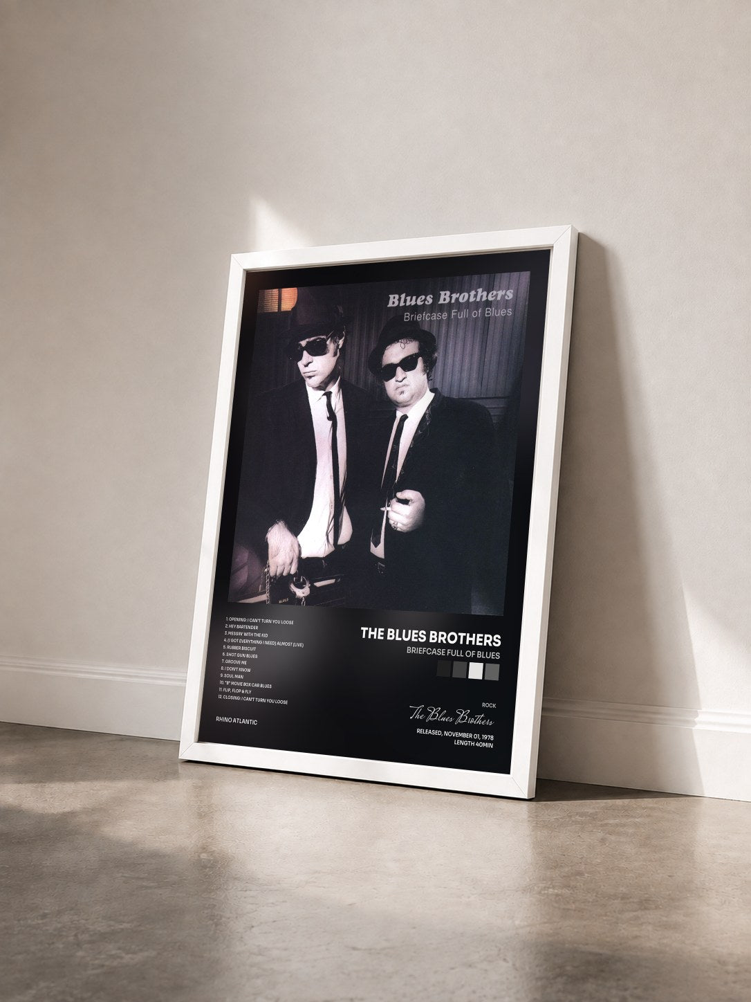#blanc Briefcase Full of Blues by The Blues Brothers as a framed art print seen at an angle, white frame