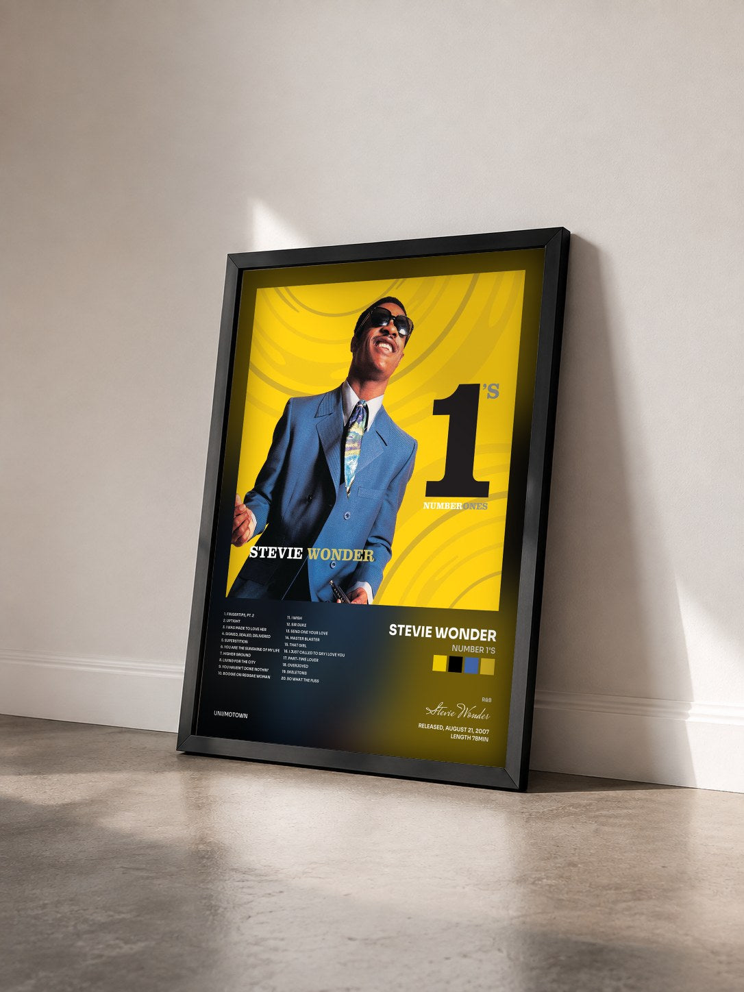 #noir Tableau de l'album Number 1's de Stevie Wonder vu de trois quarts, cadre noir