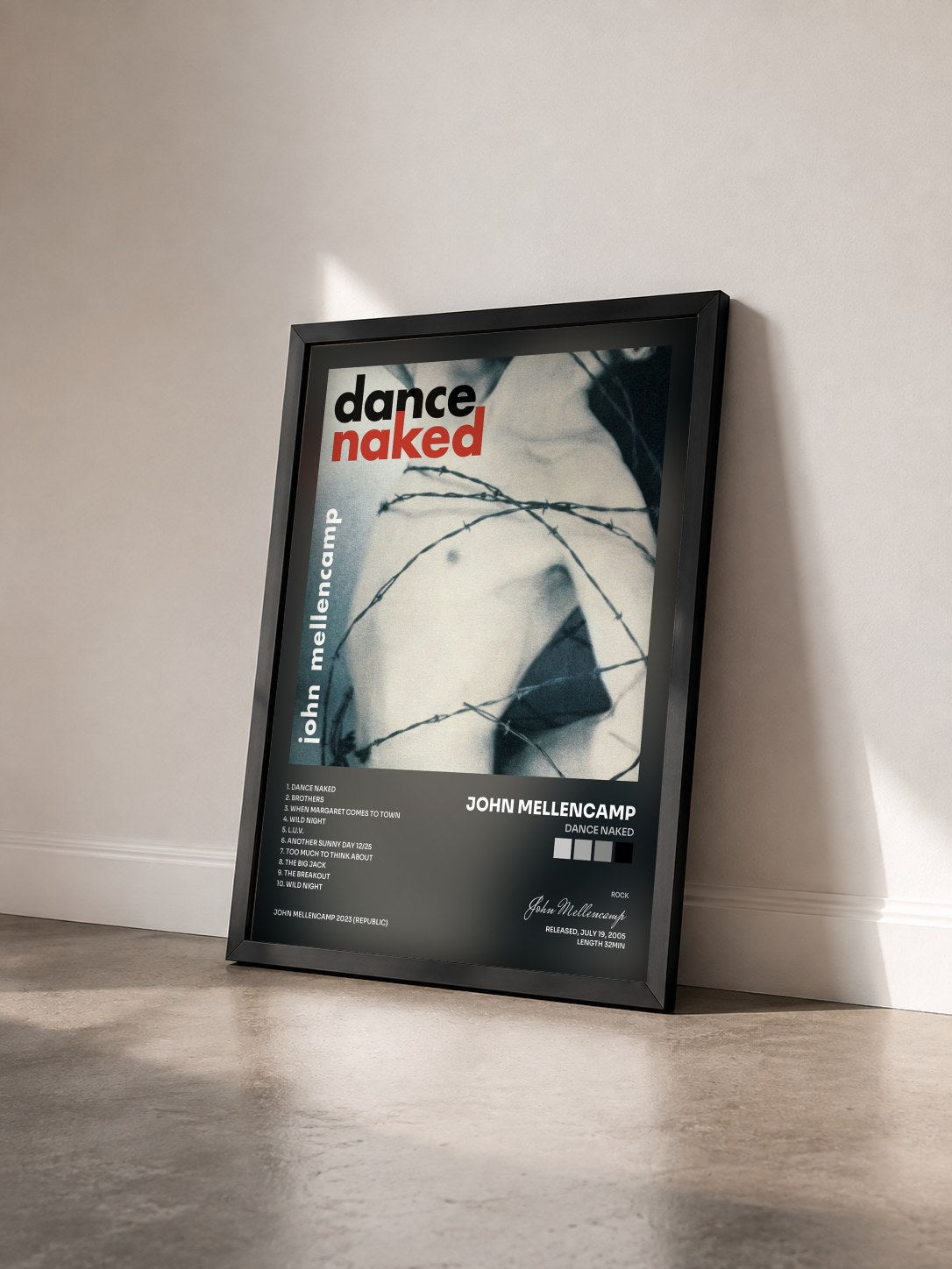 #noir Dance Naked by John Mellencamp as a framed art print seen at an angle, black frame