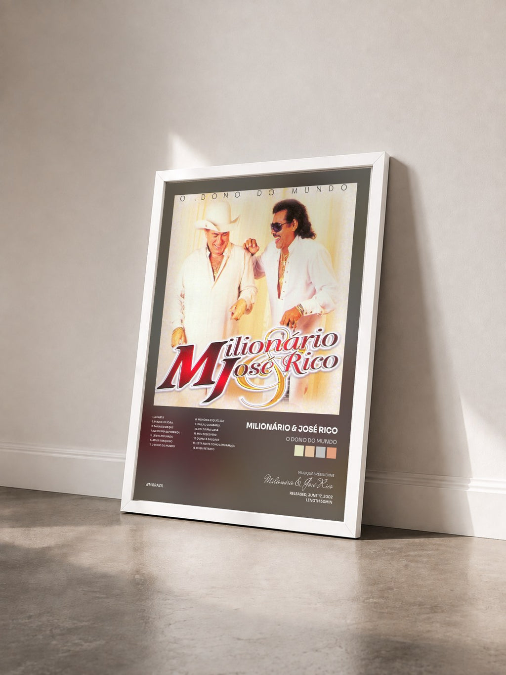 #blanc Tableau de l'album O Dono do Mundo de Milionário & José Rico vu de trois quarts, cadre blanc