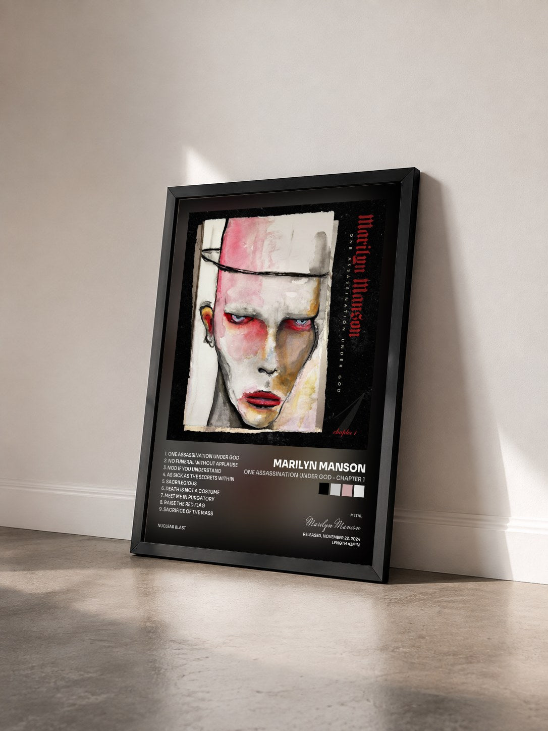 #noir Tableau de l'album One Assassination Under God - Chapter 1 de Marilyn Manson vu de trois quarts, cadre noir