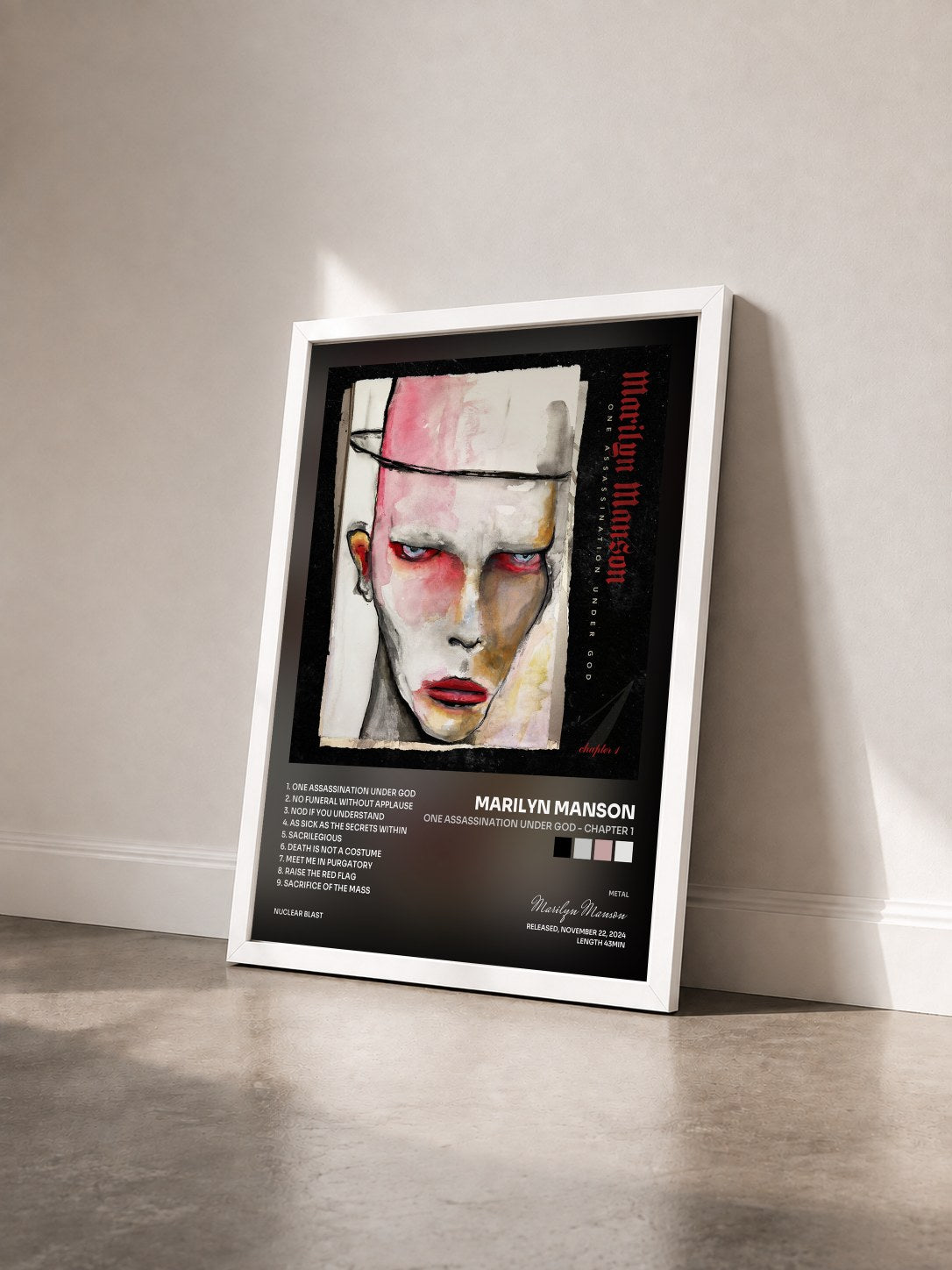 #blanc Tableau de l'album One Assassination Under God - Chapter 1 de Marilyn Manson vu de trois quarts, cadre blanc