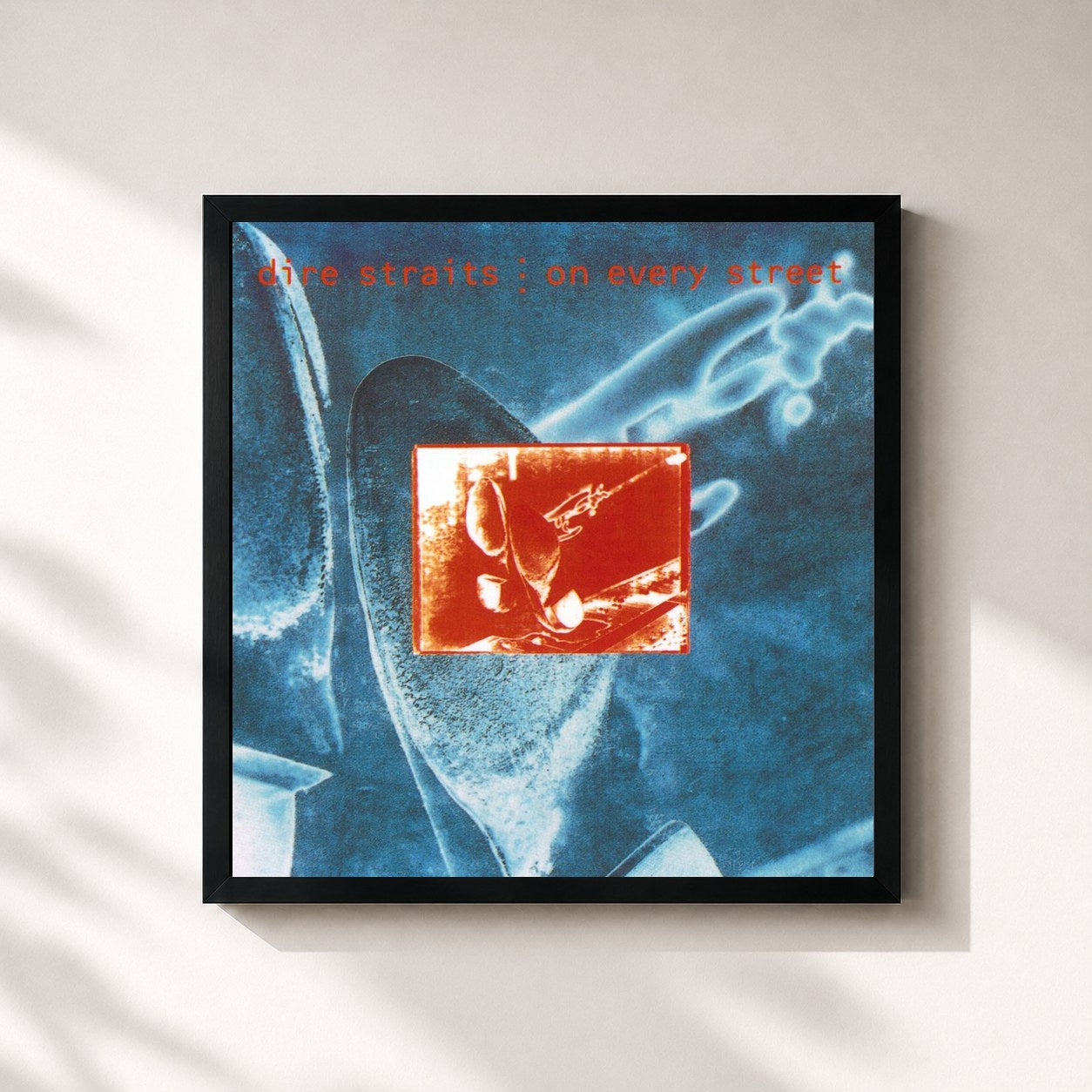 #noir On Every Street by Dire Straits as a square framed art print, black 32x32 cm frame