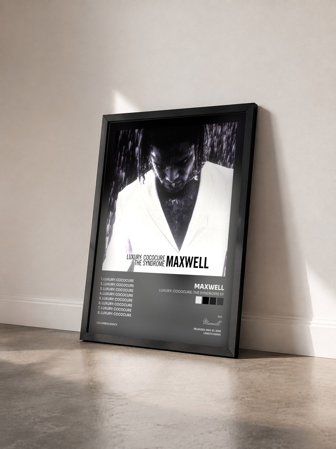#noir Tableau de l'album Luxury: Cococure: The Syndrome EP de Maxwell vu de trois quarts, cadre noir