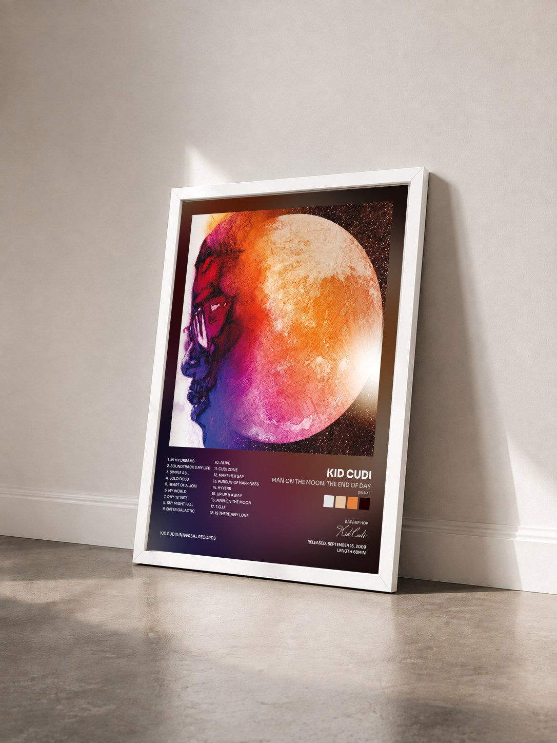 #blanc Tableau de l'album Man On The Moon: The End Of Day (Deluxe) de Kid Cudi vu de trois quarts, cadre blanc