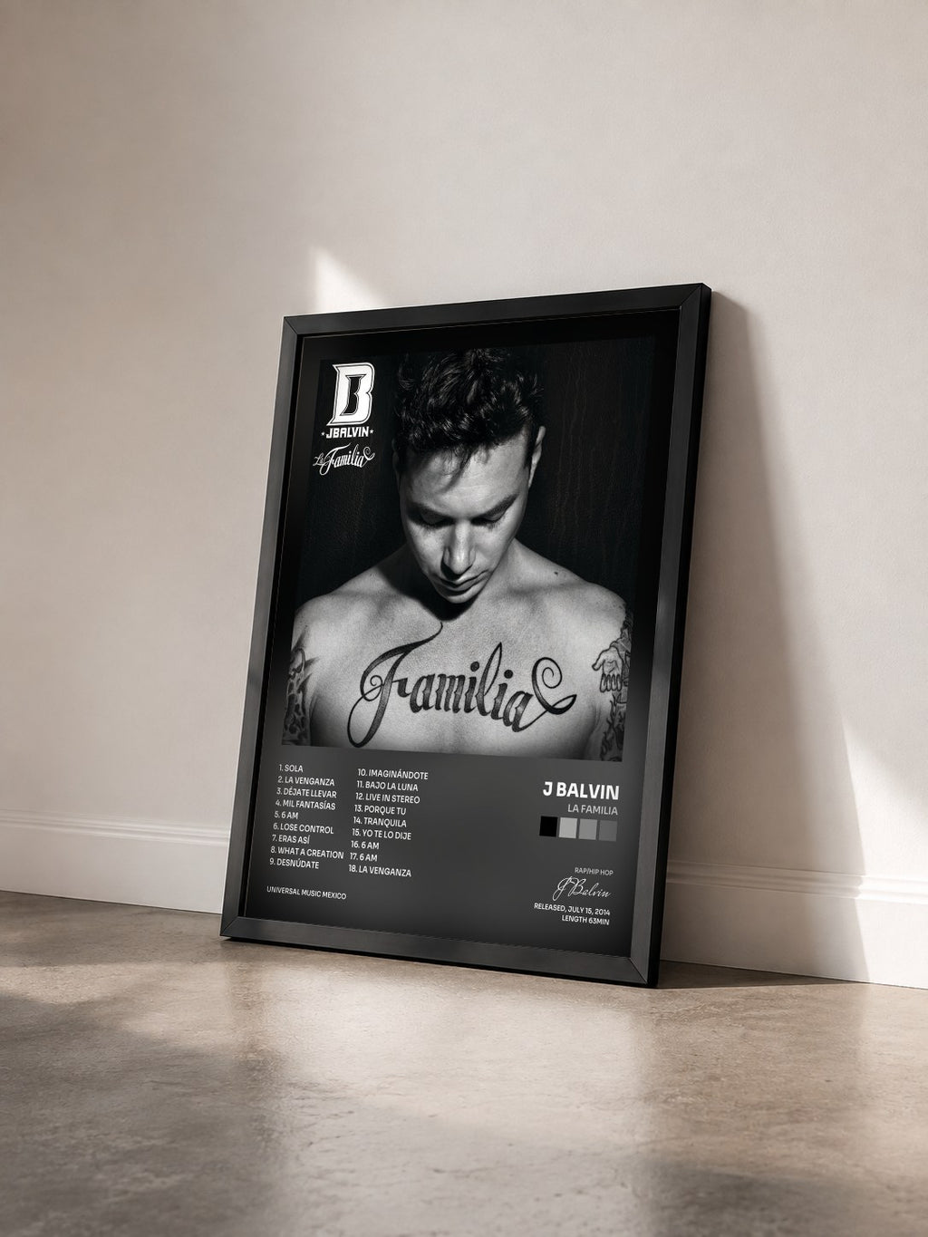 #noir Tableau de l'album La Familia de J Balvin vu de trois quarts, cadre noir