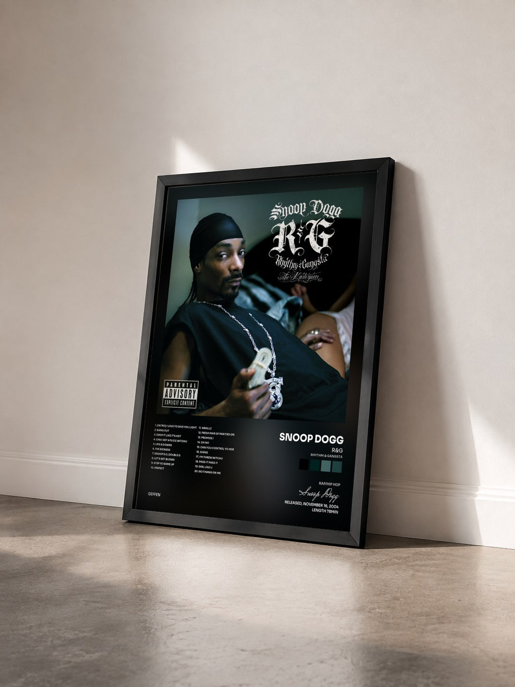 #noir R&G (Rhythm & Gangsta): The Masterpiece by Snoop Dogg as a framed art print seen at an angle, black frame