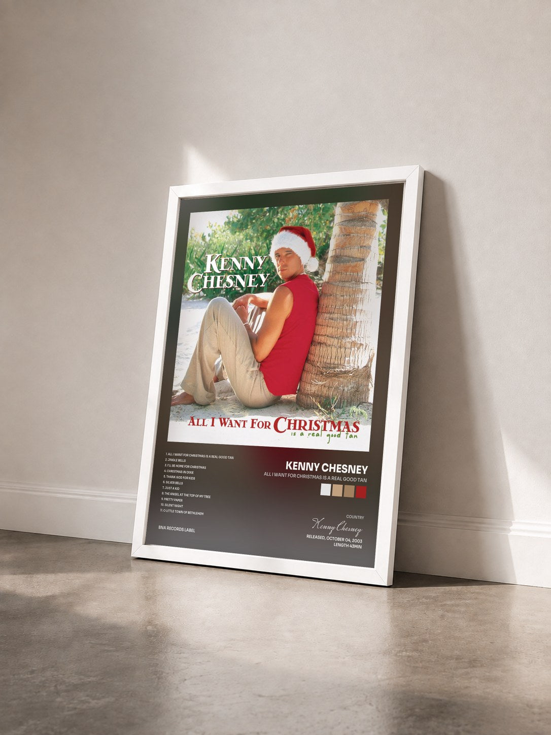 #blanc Tableau de l'album All I Want For Christmas Is A Real Good Tan de Kenny Chesney vu de trois quarts, cadre blanc