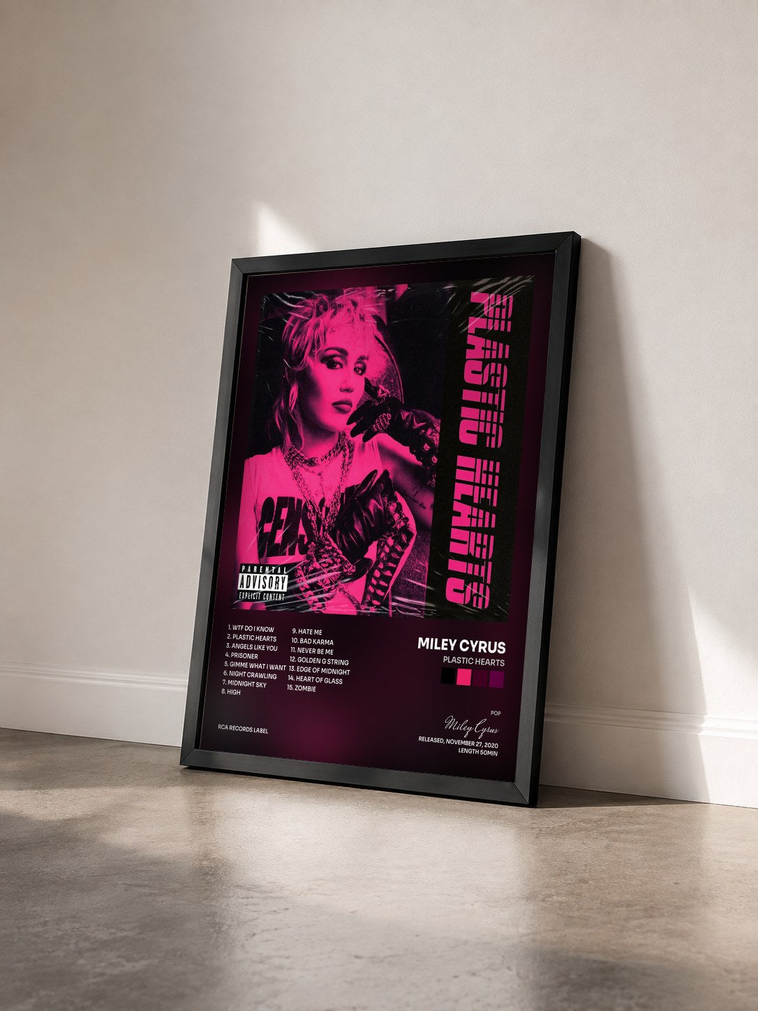 #noir Plastic Hearts by Miley Cyrus as a framed art print seen at an angle, black frame