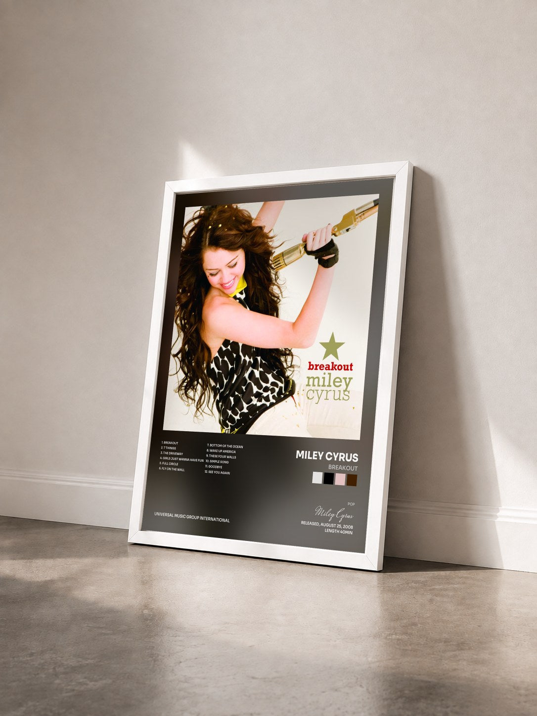 #blanc Tableau de l'album Breakout de Miley Cyrus vu de trois quarts, cadre blanc
