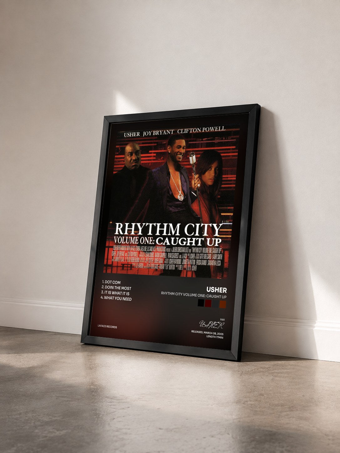 #noir Tableau de l'album Rhythm City Volume One: Caught Up de USHER vu de trois quarts, cadre noir