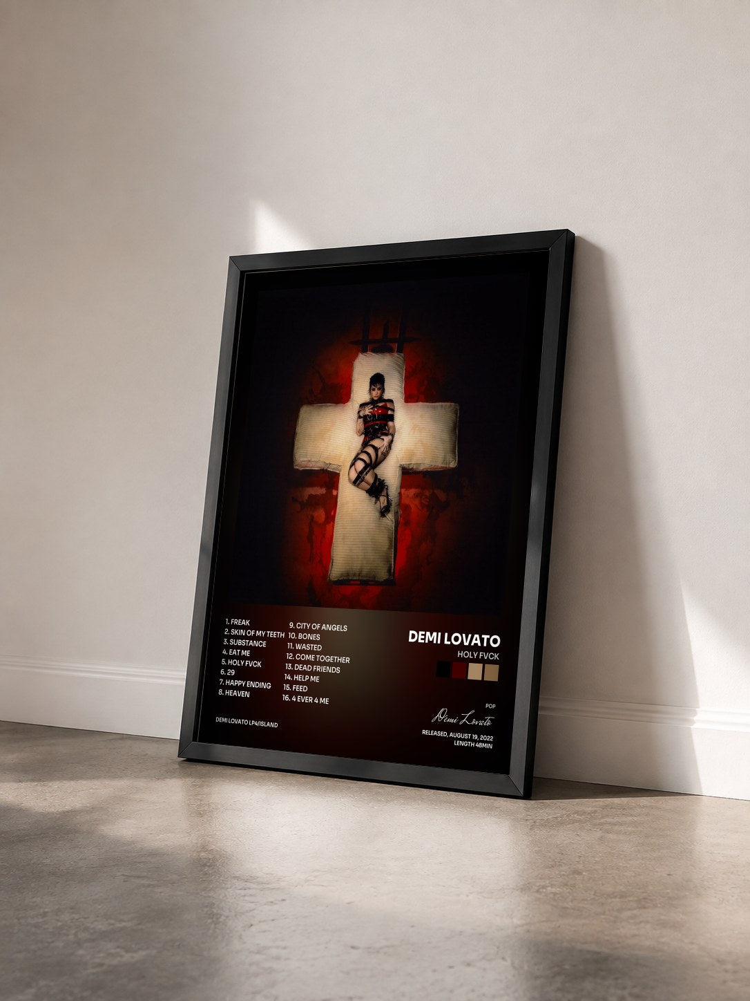 #noir Tableau de l'album HOLY FVCK de Demi Lovato vu de trois quarts, cadre noir