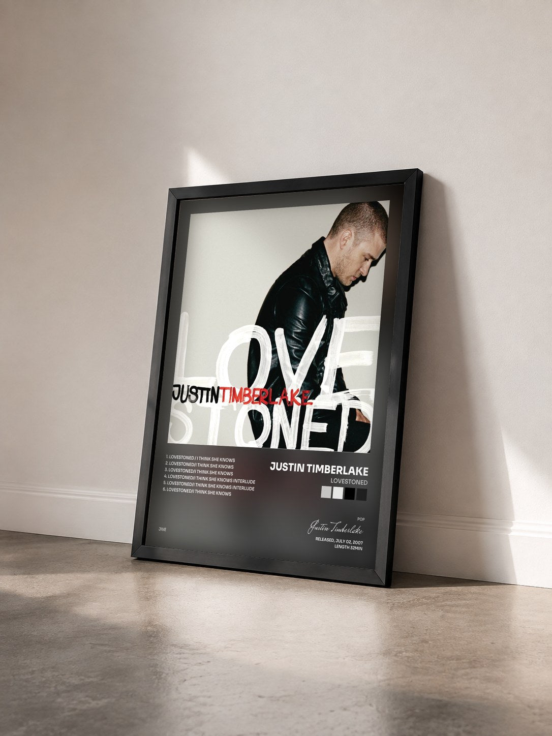#noir Tableau de l'album LoveStoned de Justin Timberlake vu de trois quarts, cadre noir