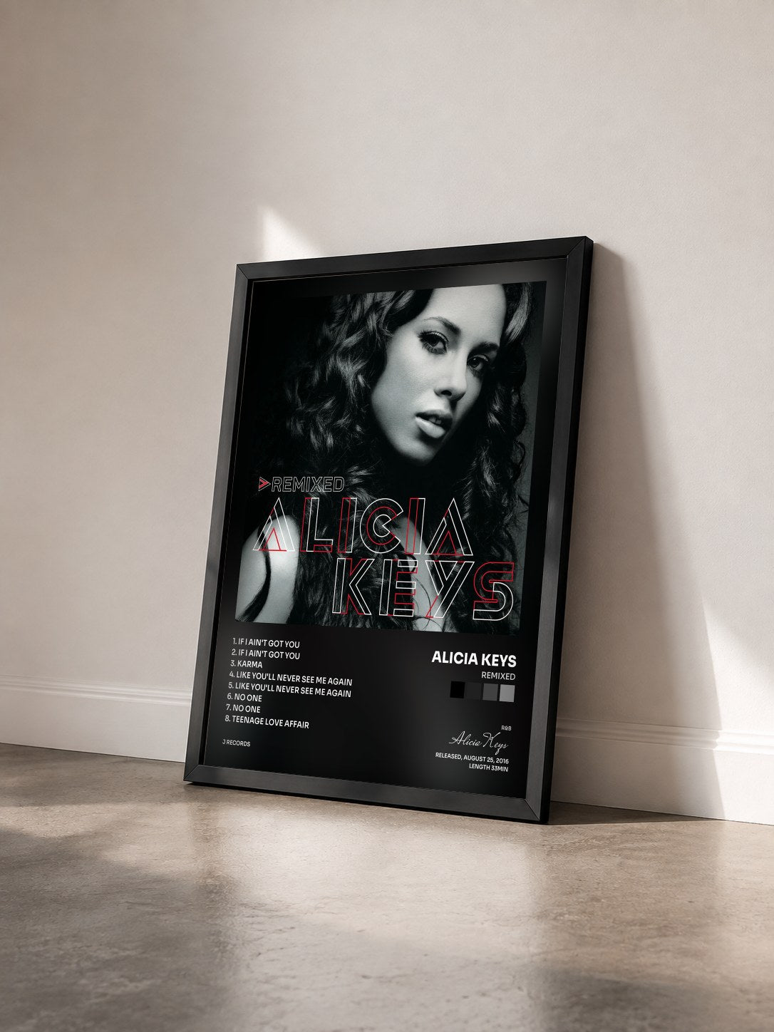 #noir Tableau de l'album Remixed de Alicia Keys vu de trois quarts, cadre noir