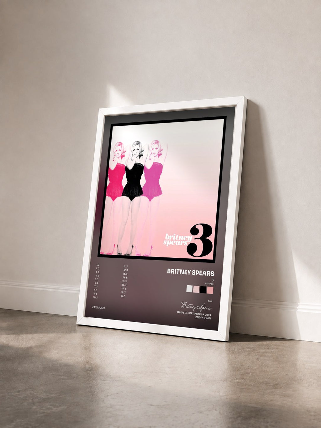 #blanc Tableau de l'album 3 (Remixes) de Britney Spears vu de trois quarts, cadre blanc