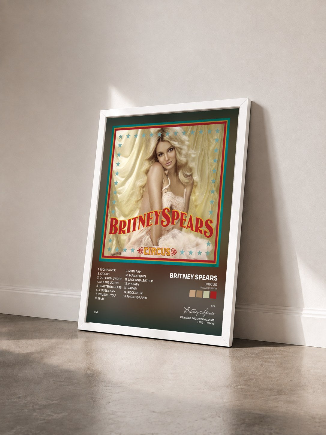 #blanc Tableau de l'album Circus (Deluxe Version) de Britney Spears vu de trois quarts, cadre blanc