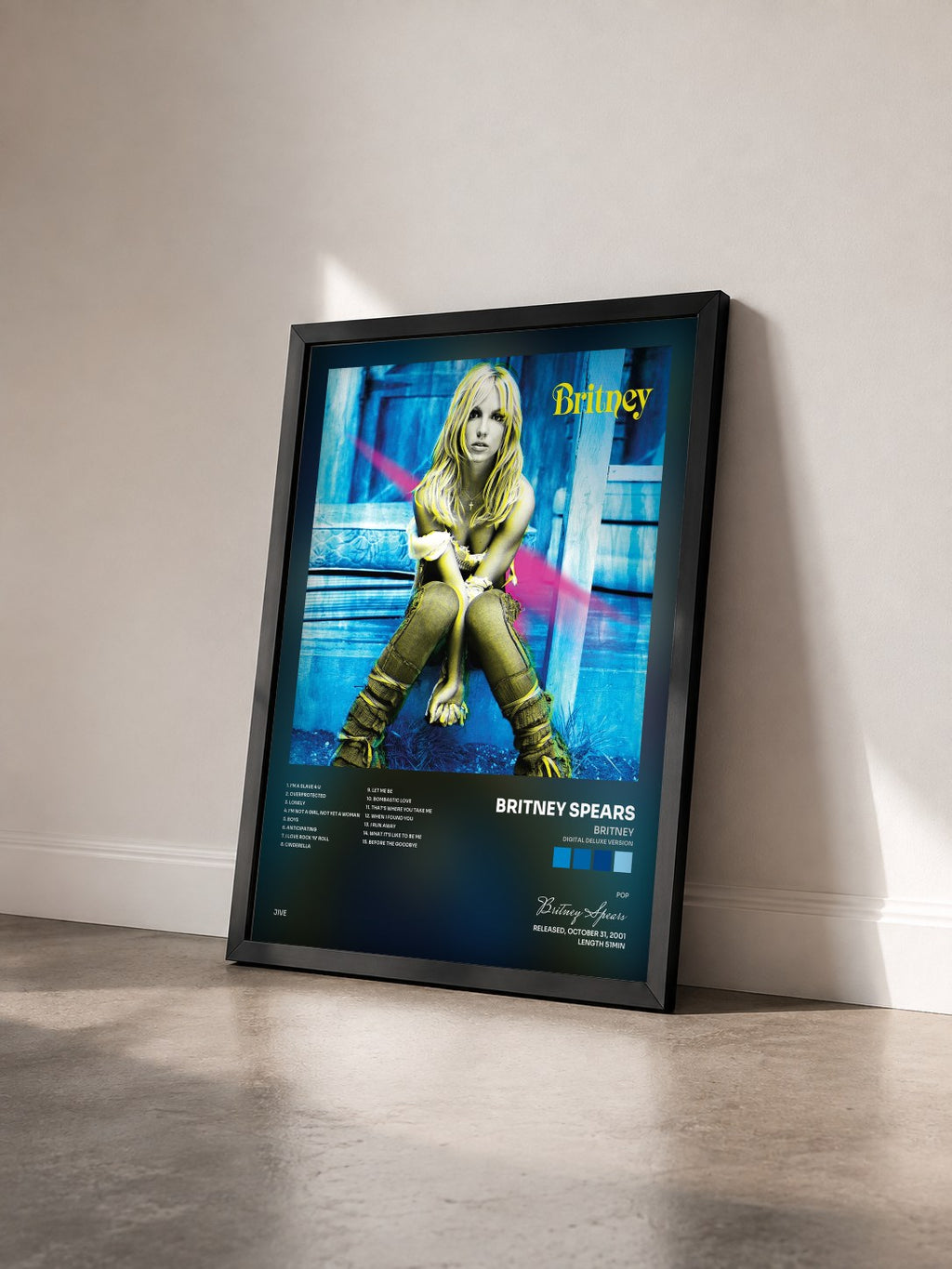 #noir Tableau de l'album Britney (Digital Deluxe Version) de Britney Spears vu de trois quarts, cadre noir
