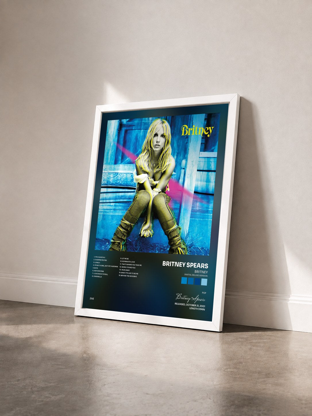 #blanc Tableau de l'album Britney (Digital Deluxe Version) de Britney Spears vu de trois quarts, cadre blanc