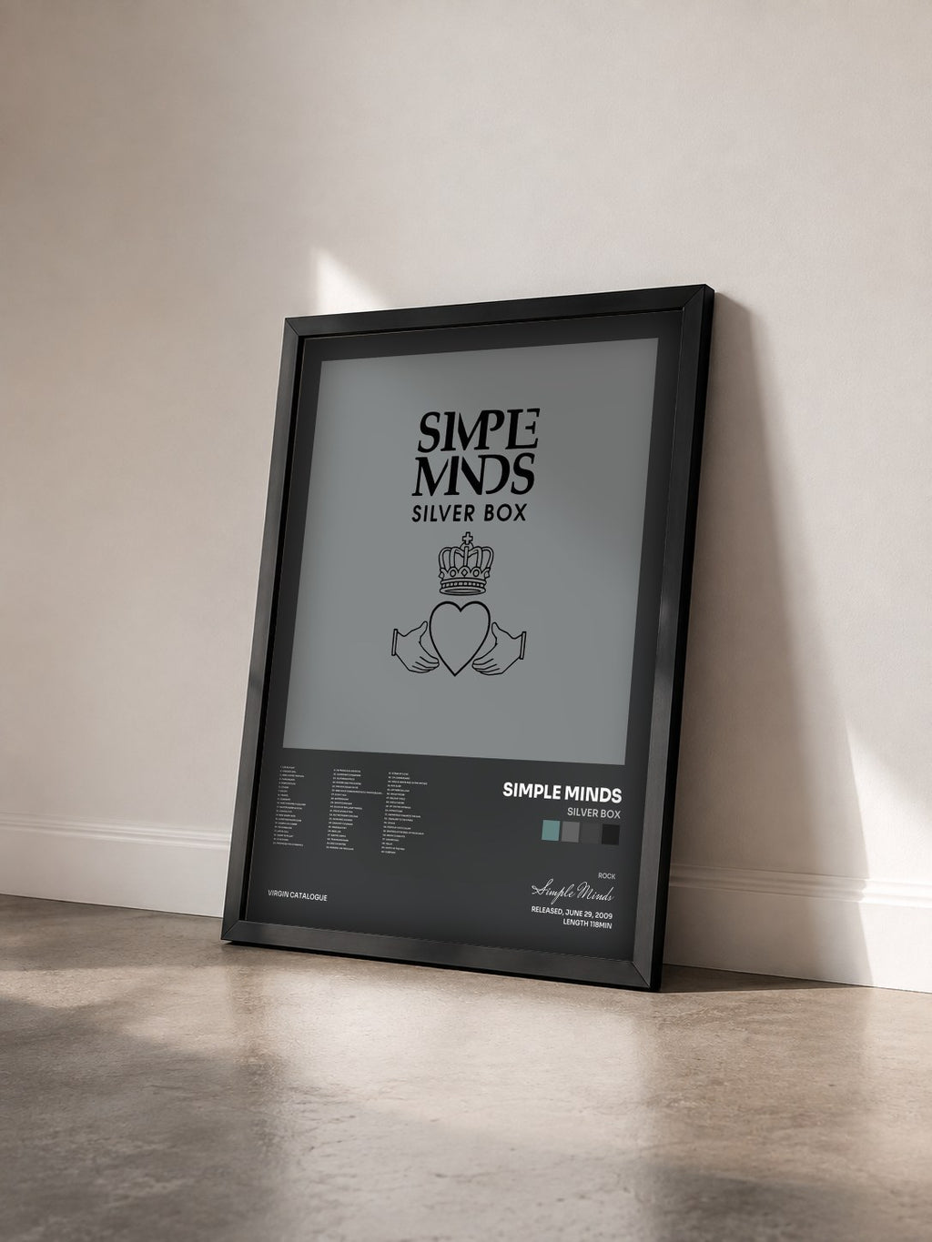 #noir Tableau de l'album Silver Box de Simple Minds vu de trois quarts, cadre noir