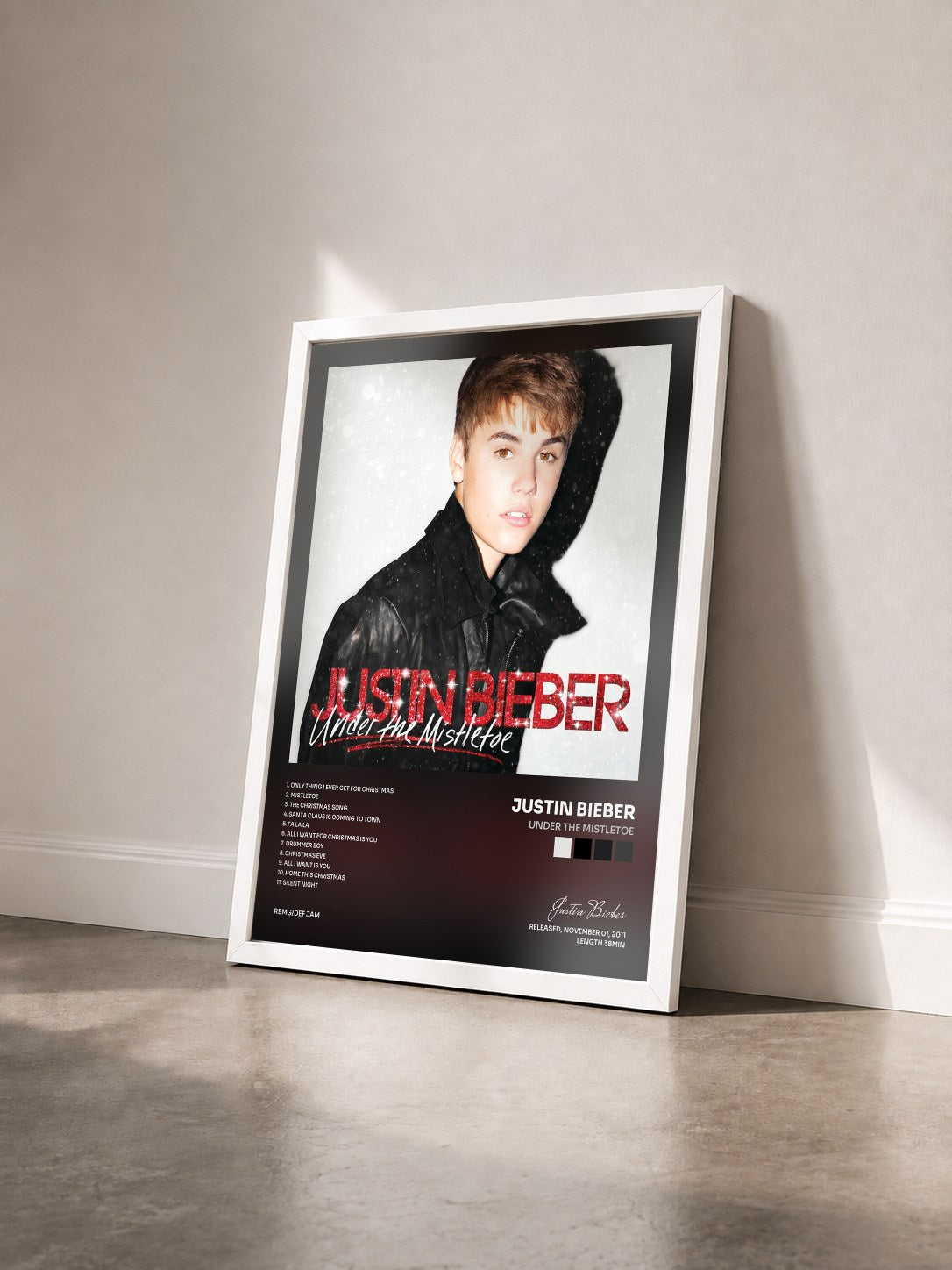 #blanc Tableau de l'album Under The Mistletoe de Justin Bieber vu de trois quarts, cadre blanc