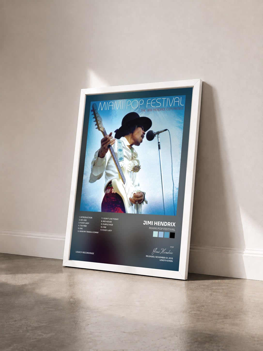 #blanc Tableau de l'album Miami Pop Festival de Jimi Hendrix vu de trois quarts, cadre blanc