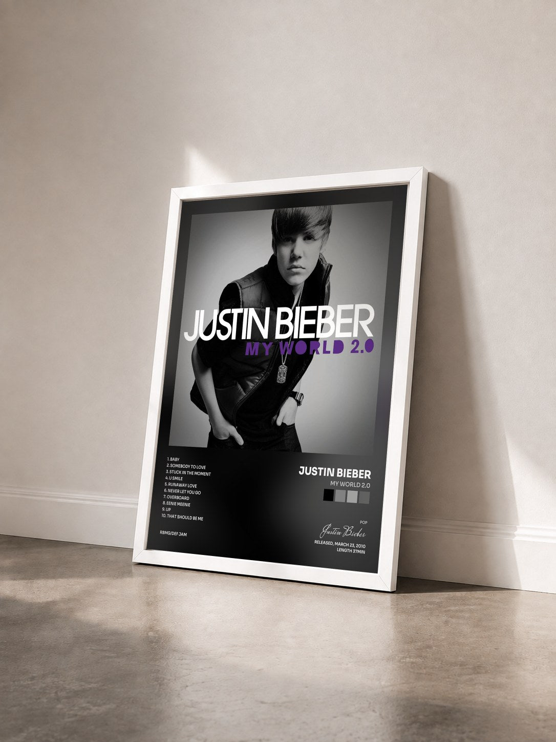 #blanc Tableau de l'album My World 2.0 de Justin Bieber vu de trois quarts, cadre blanc