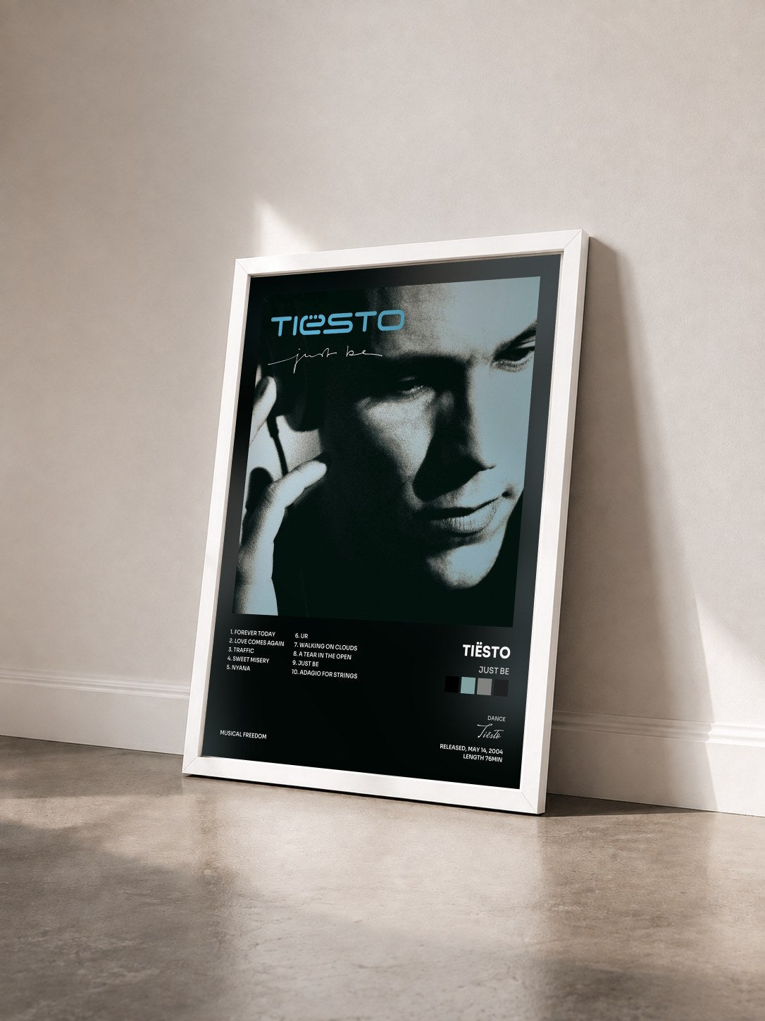 #blanc Tableau de l'album Just Be de Tiësto vu de trois quarts, cadre blanc