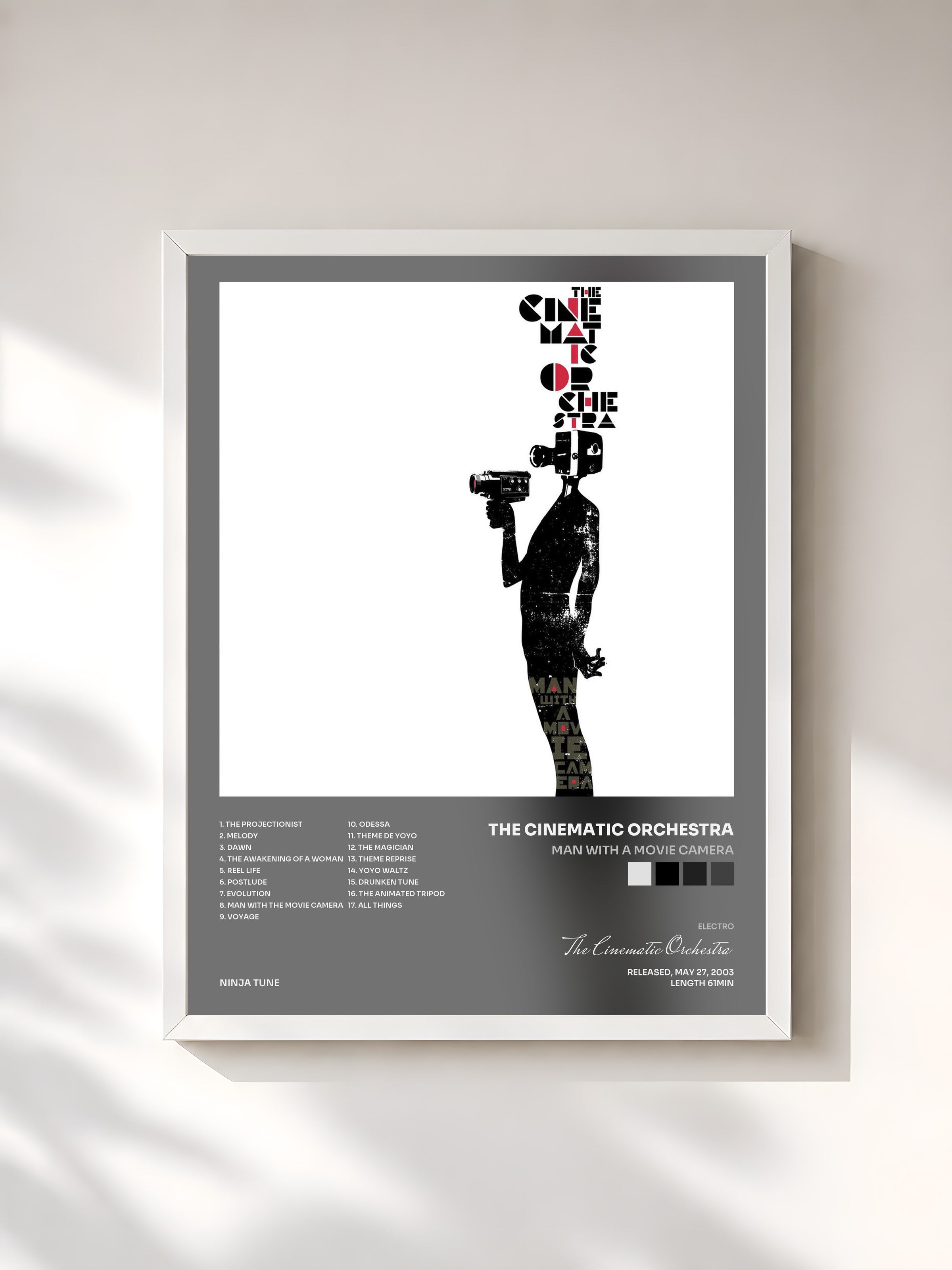 #blanc Tableau de l'album Man With A Movie Camera de The Cinematic Orchestra, cadre blanc, imprimé et encadré en France