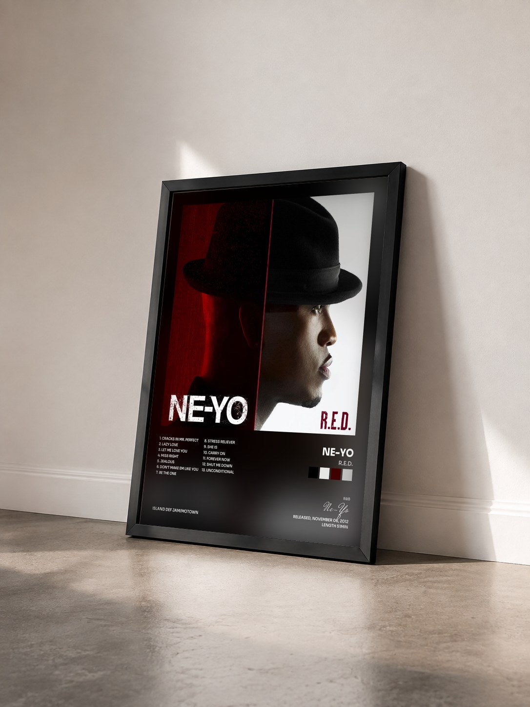 #noir R.E.D. by Ne-Yo as a framed art print seen at an angle, black frame