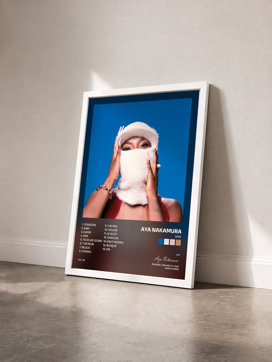#blanc DNK by Aya Nakamura as a framed art print seen at an angle, white frame