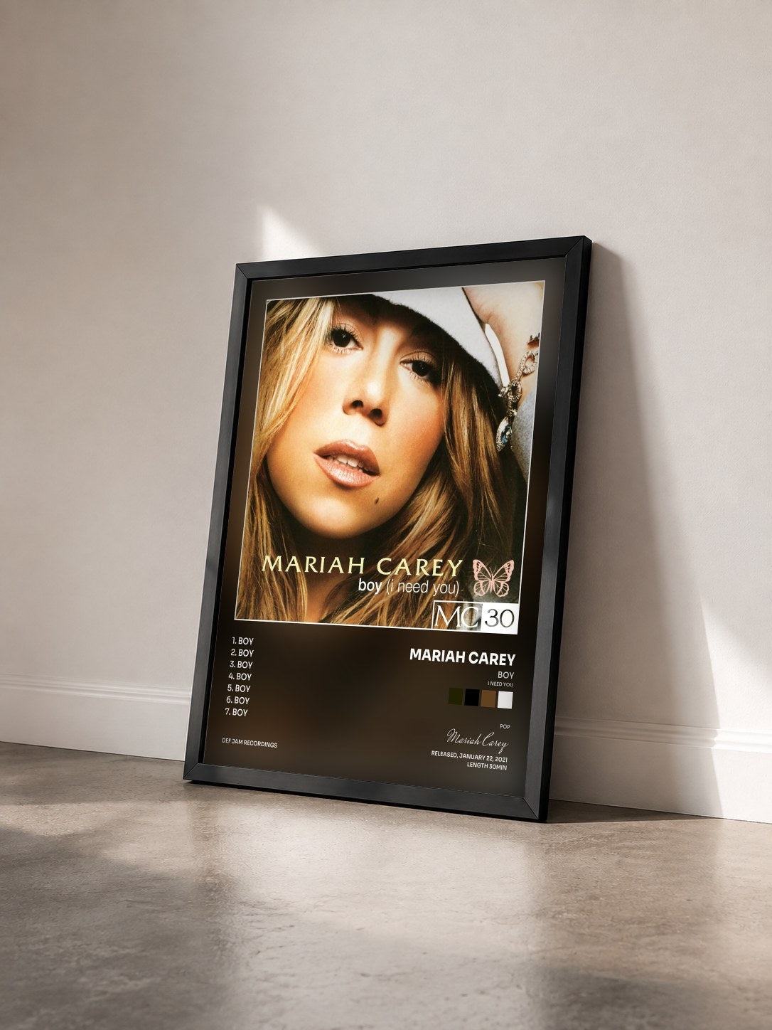 #noir Tableau de l'album Boy (I Need You) - EP de Mariah Carey vu de trois quarts, cadre noir